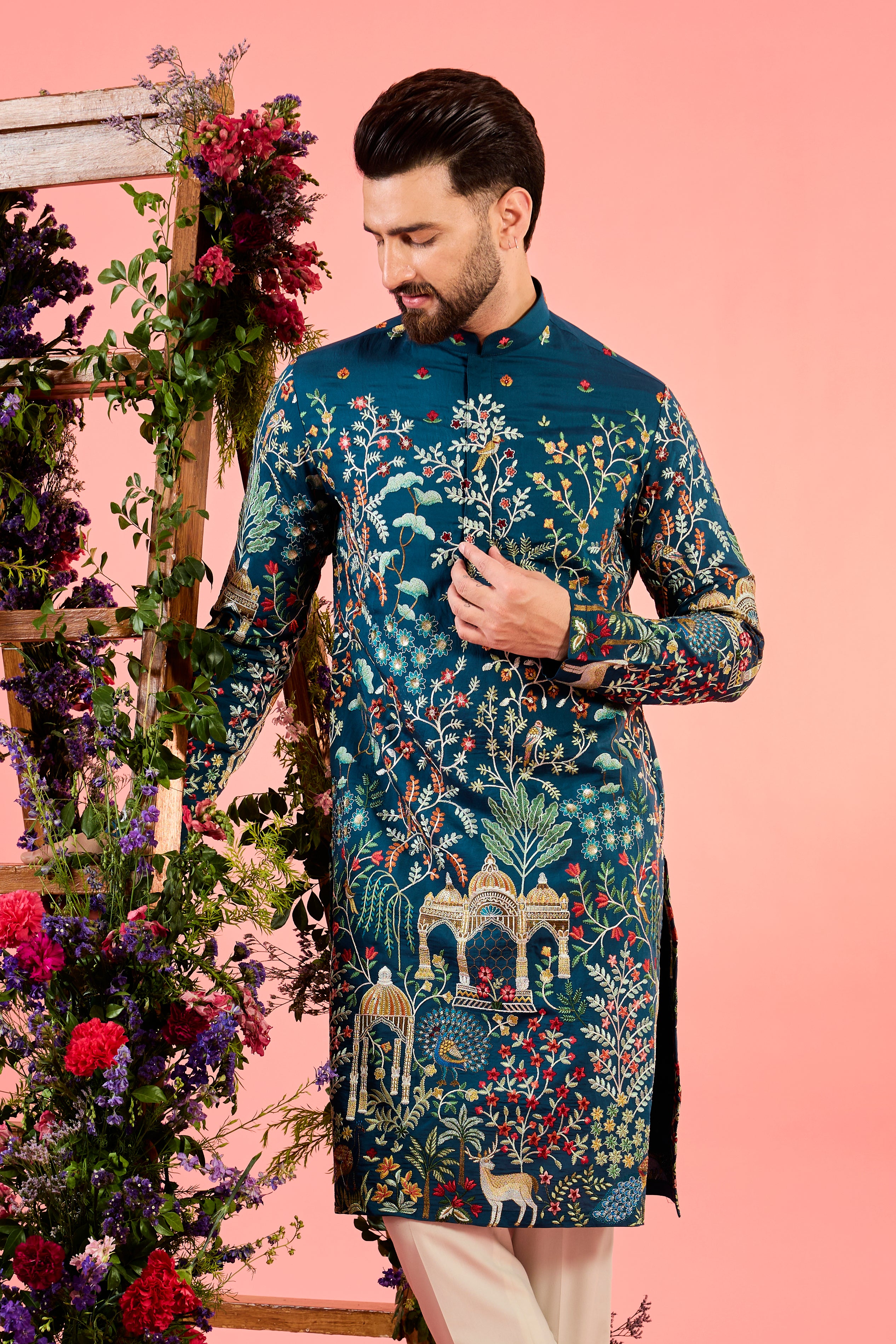 blue chikankari kurta with intricate flora and fauna embroidery