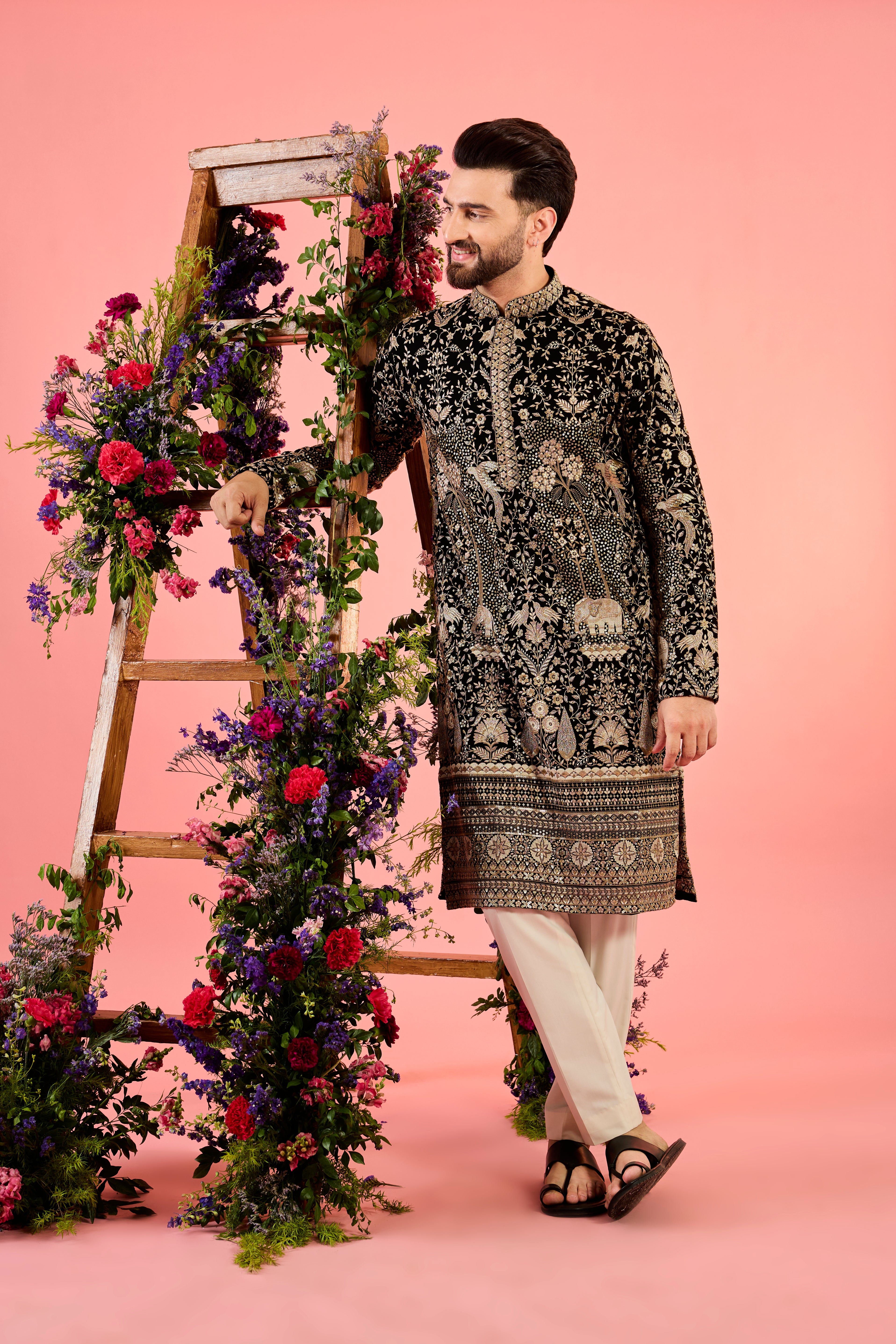 black sequined kurta with intricate flora and fauna embroidery