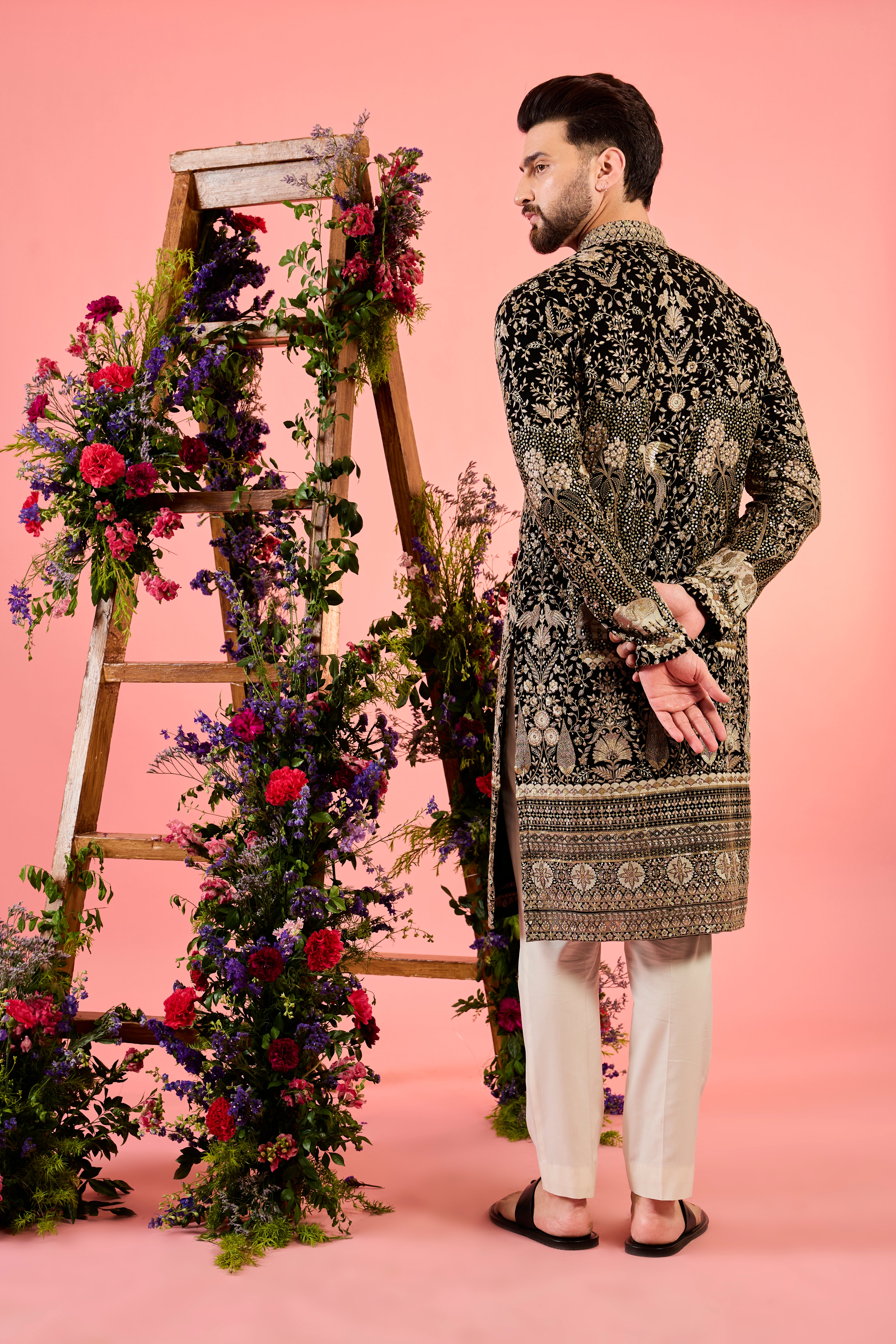 black sequined kurta with intricate flora and fauna embroidery