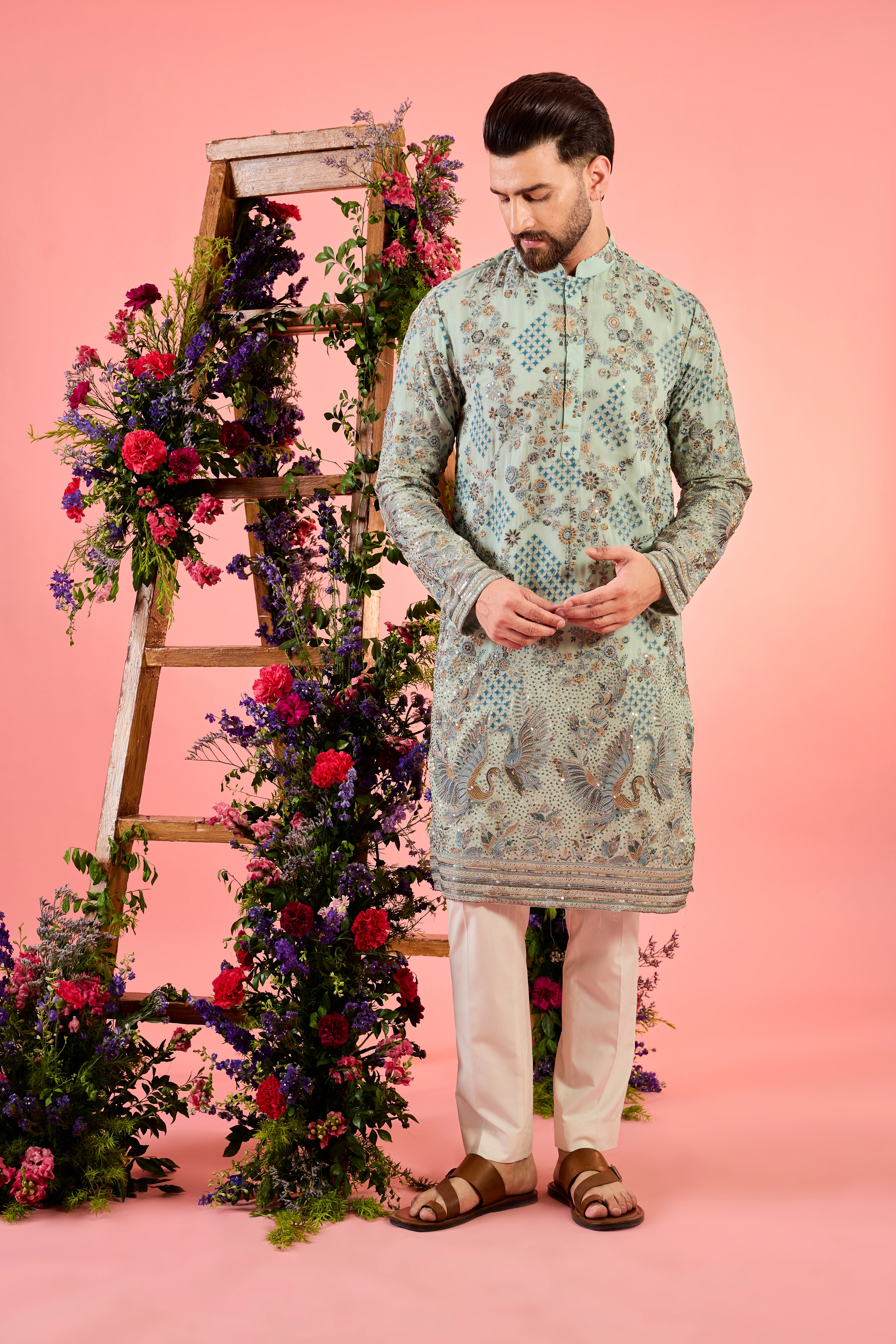 green chikankari kurta with intricate flora and fauna embroidery