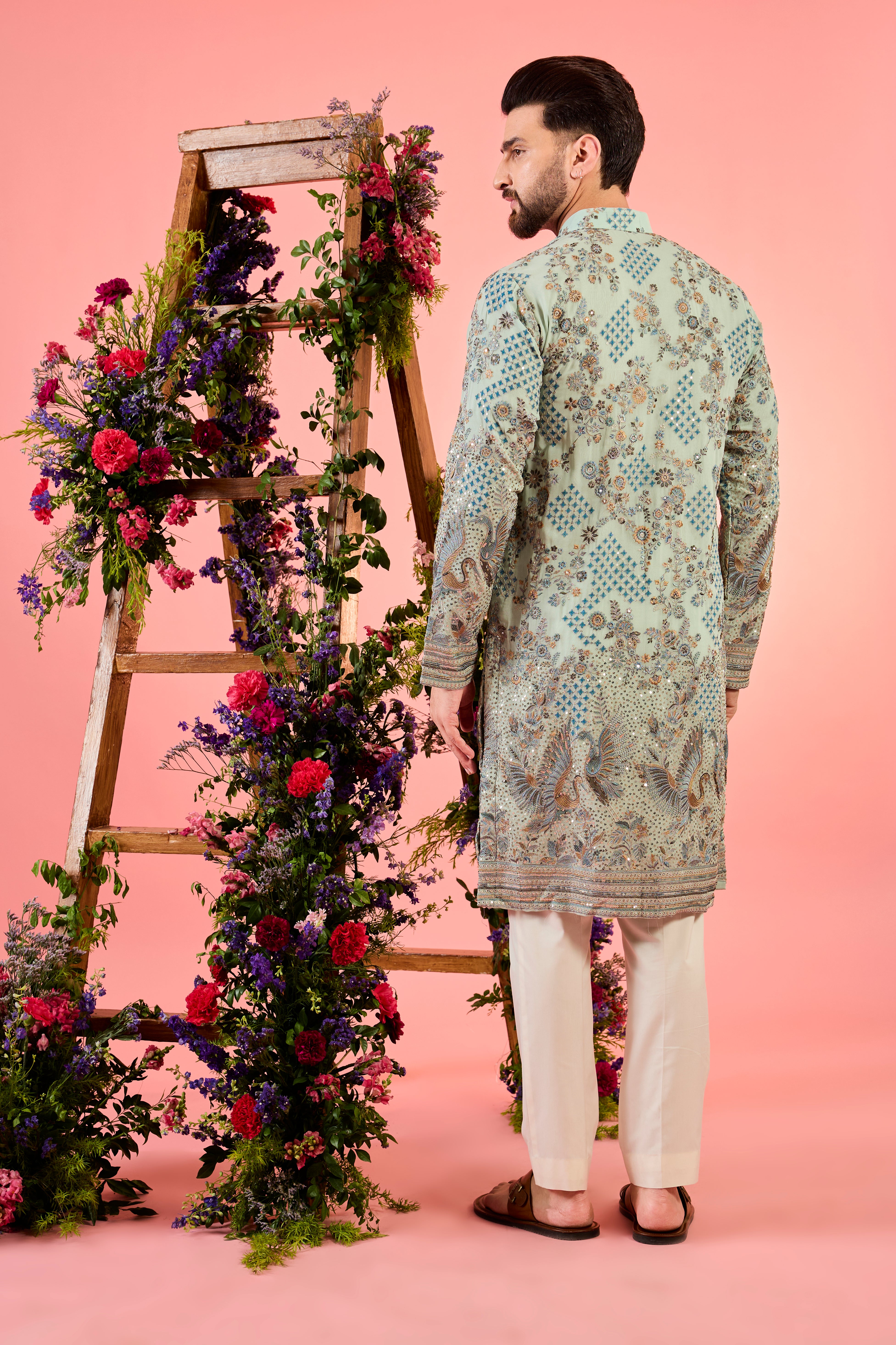 green chikankari kurta with intricate flora and fauna embroidery