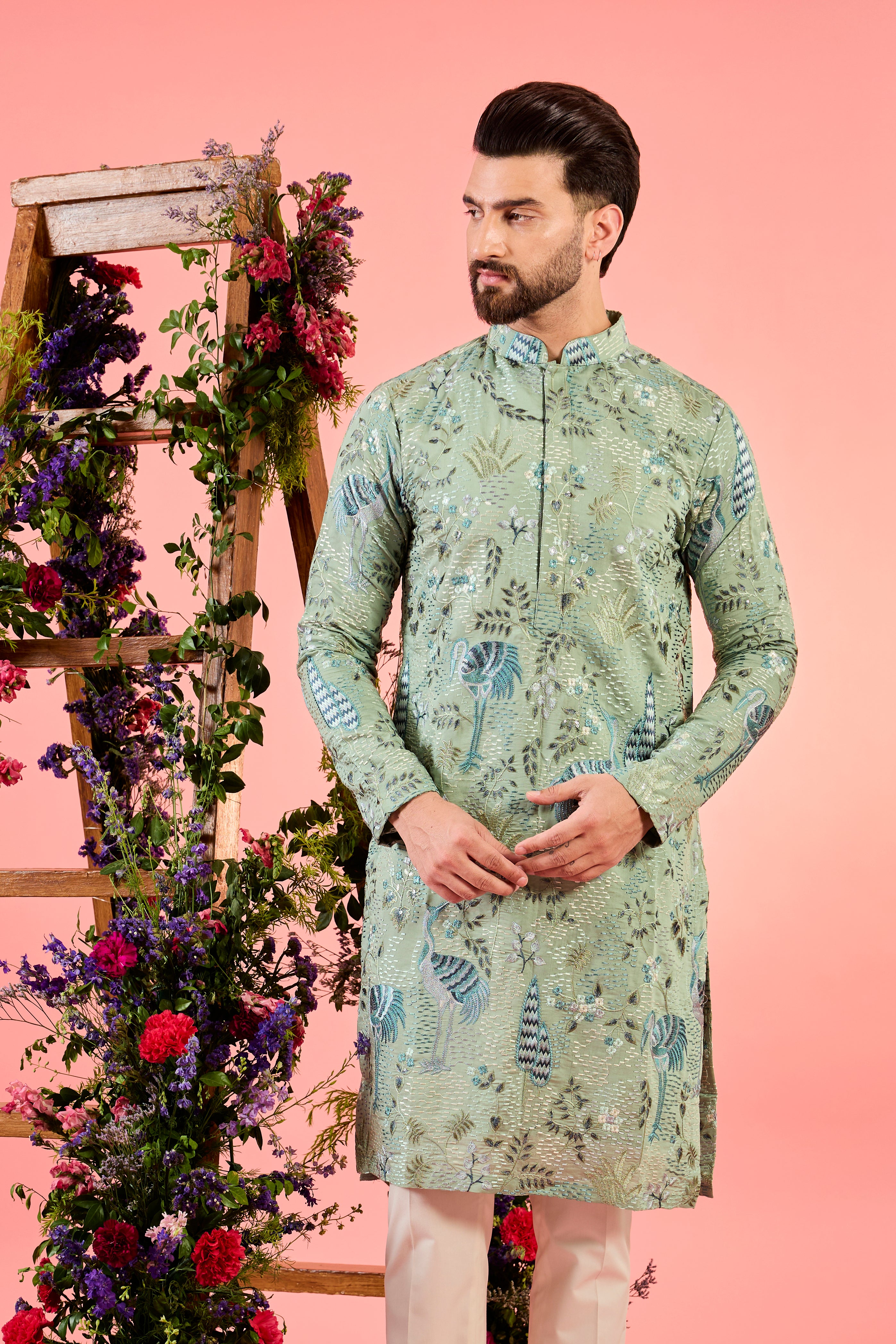 mint green thread work kurta with intricate flora and fauna emnroidery