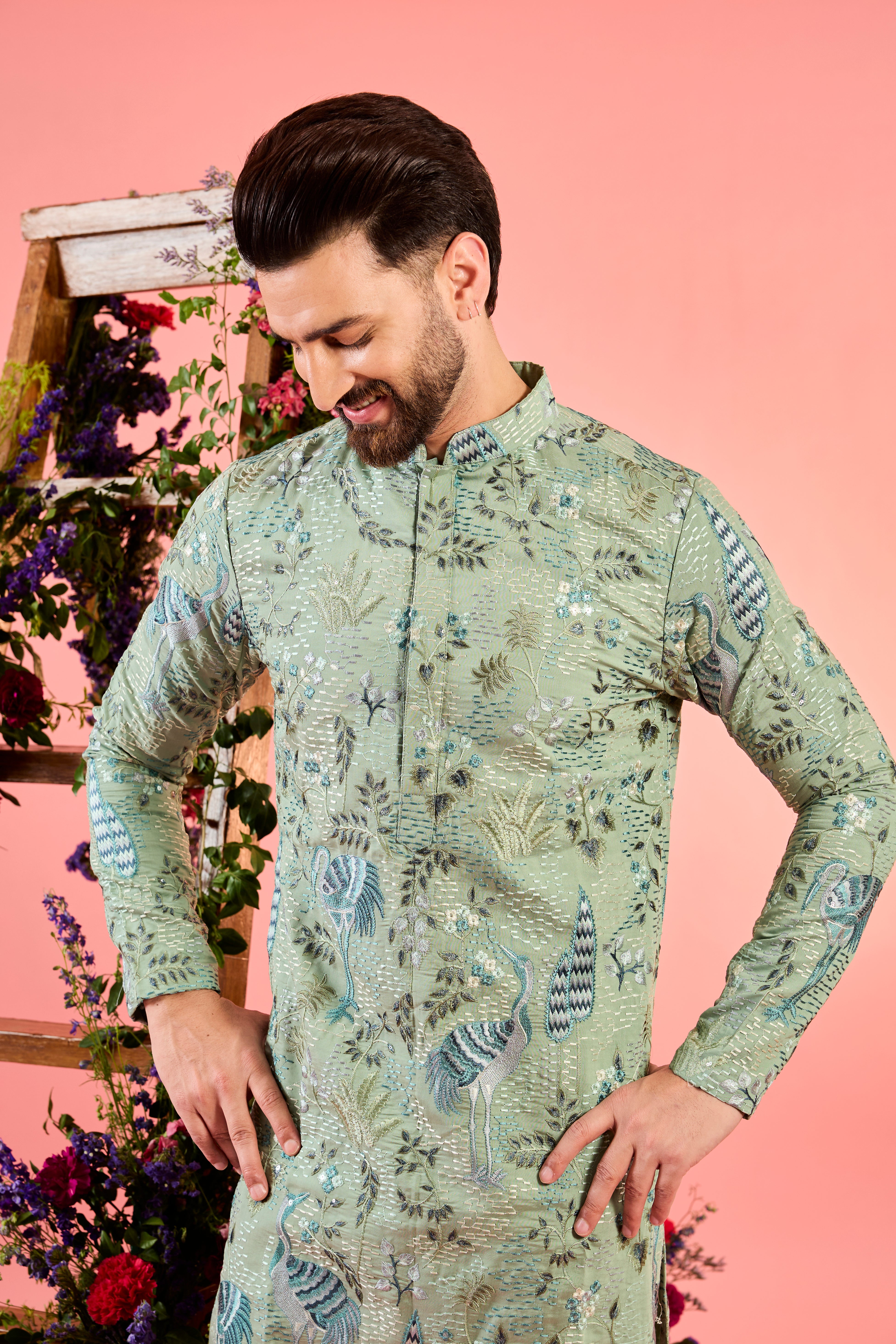 mint green thread work kurta with intricate flora and fauna emnroidery