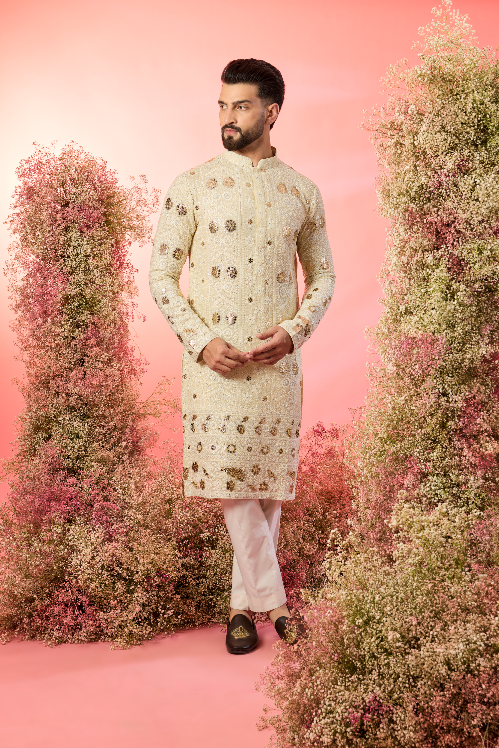 cream chikankari kurta with intricate leather patchwork and delicate sequin work