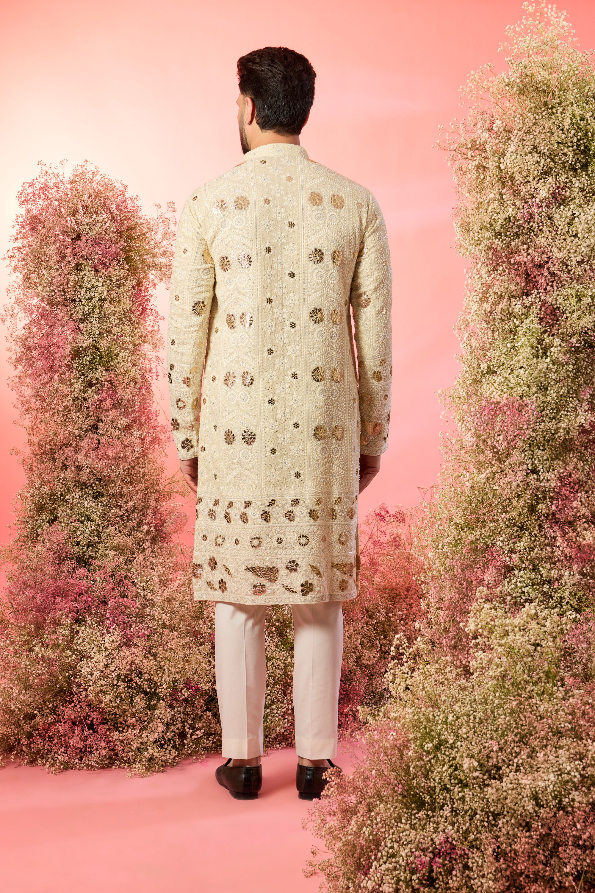 cream chikankari kurta with intricate leather patchwork and delicate sequin work