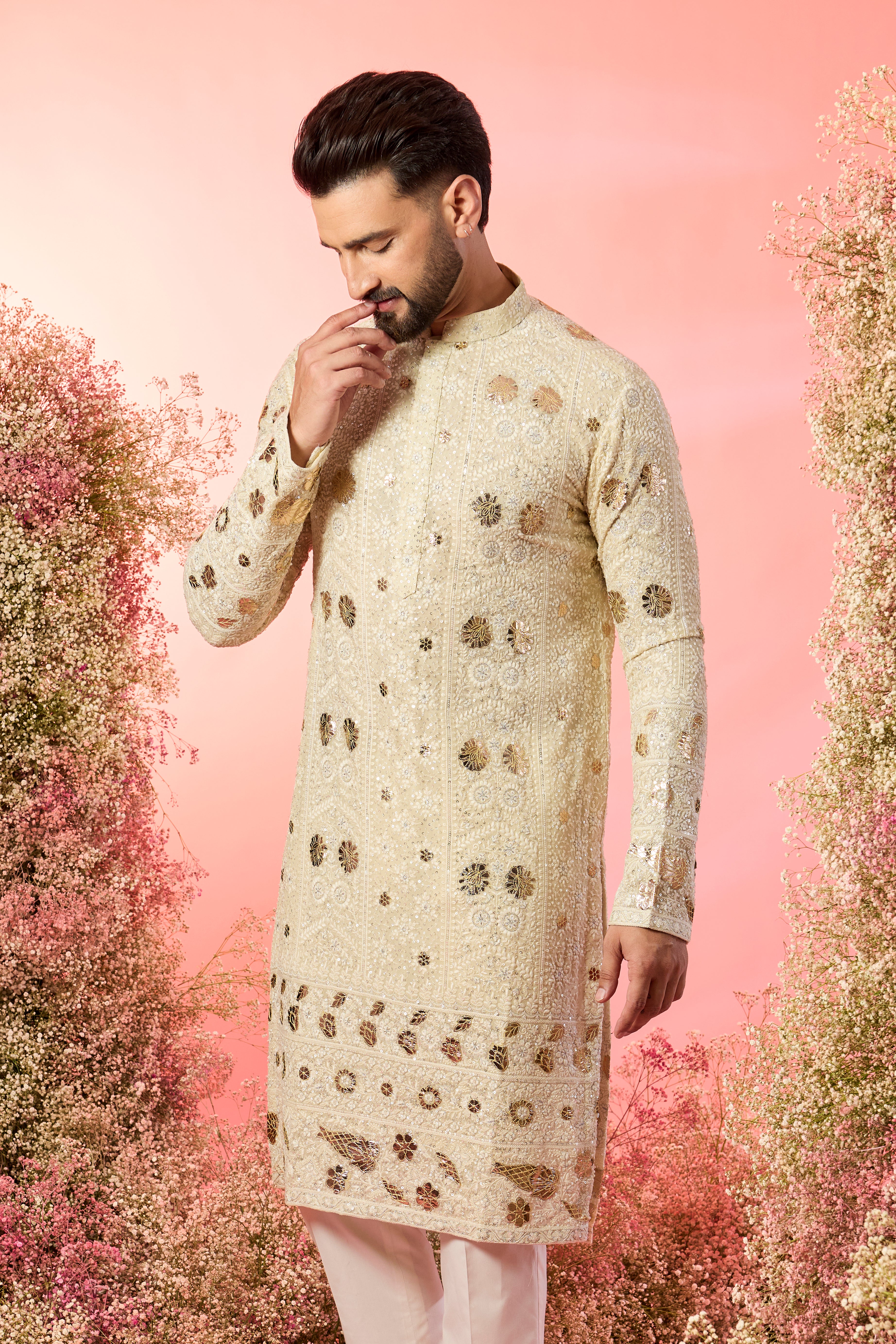 cream chikankari kurta with intricate leather patchwork and delicate sequin work