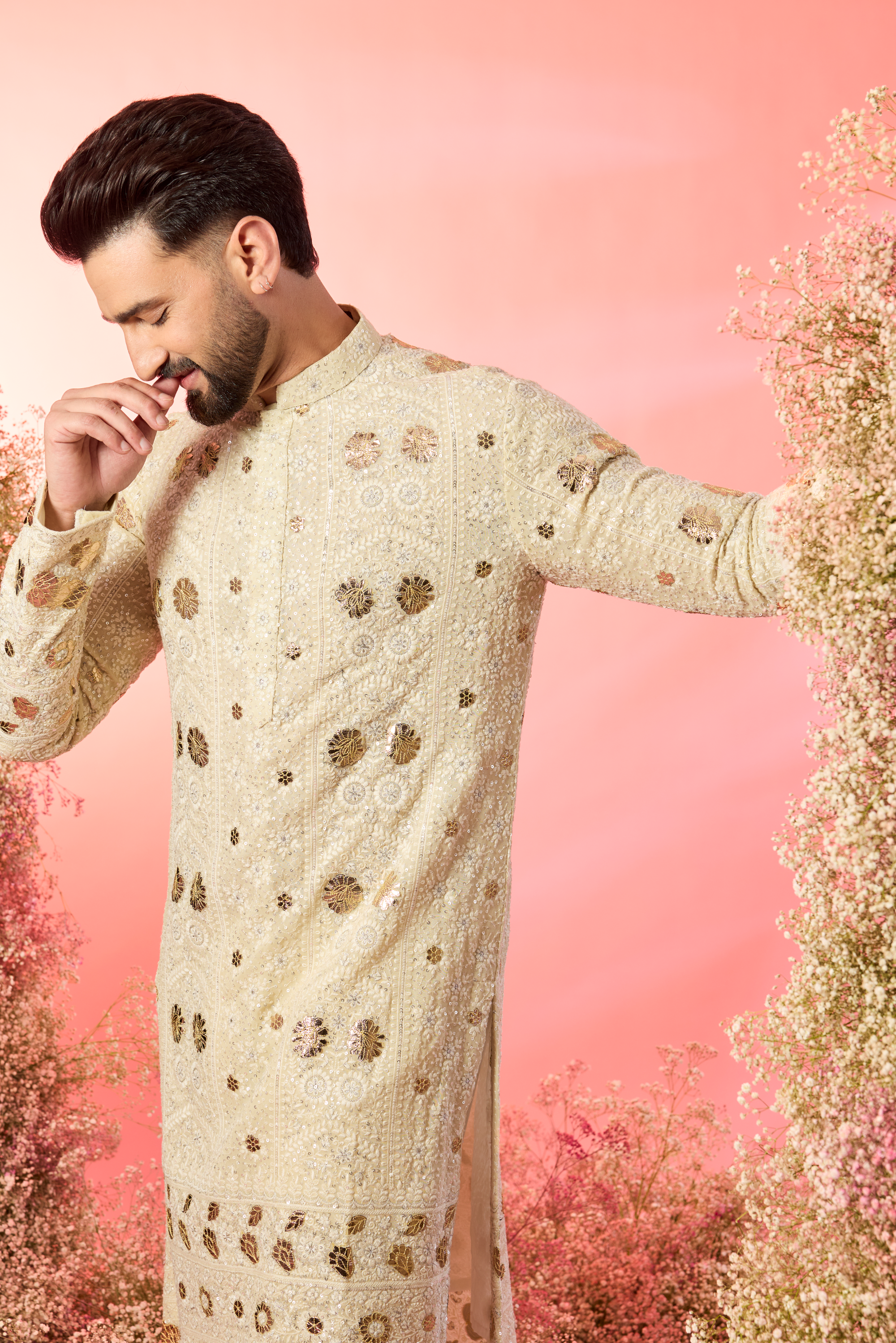 cream chikankari kurta with intricate leather patchwork and delicate sequin work
