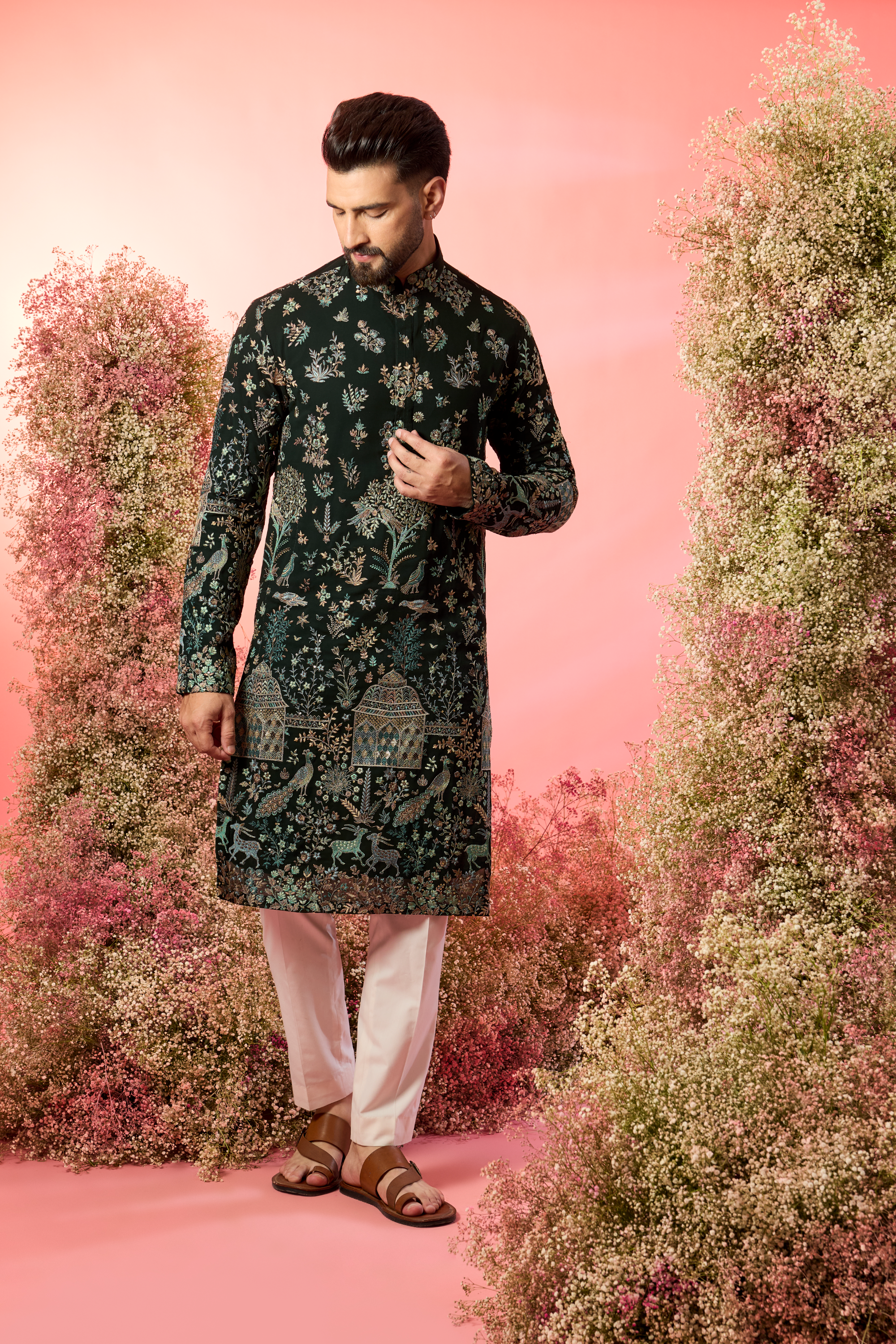 green chinakari kurta with intricate flora and fauna embroidery