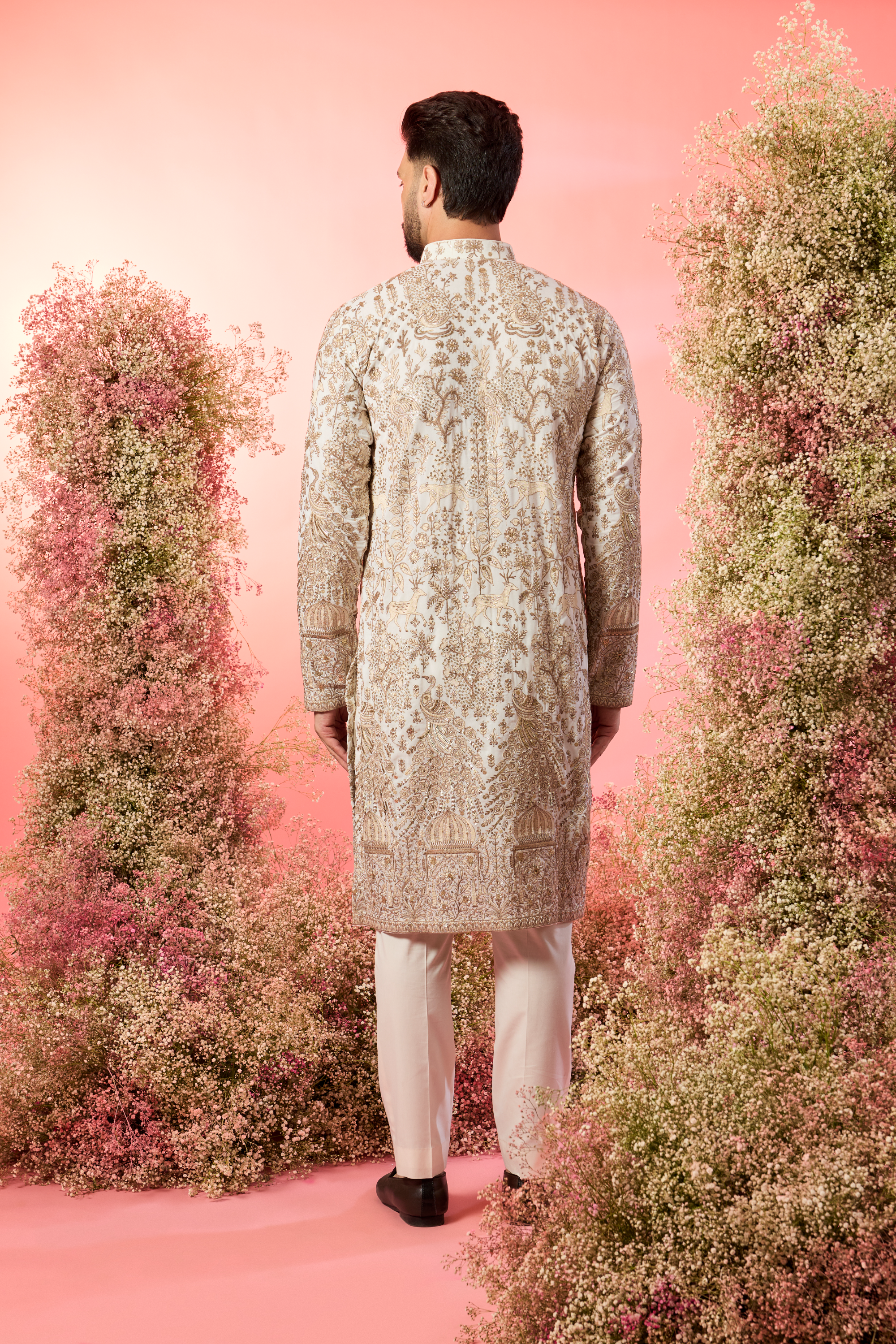 White zari kurta with inricate frlora and fauna figures