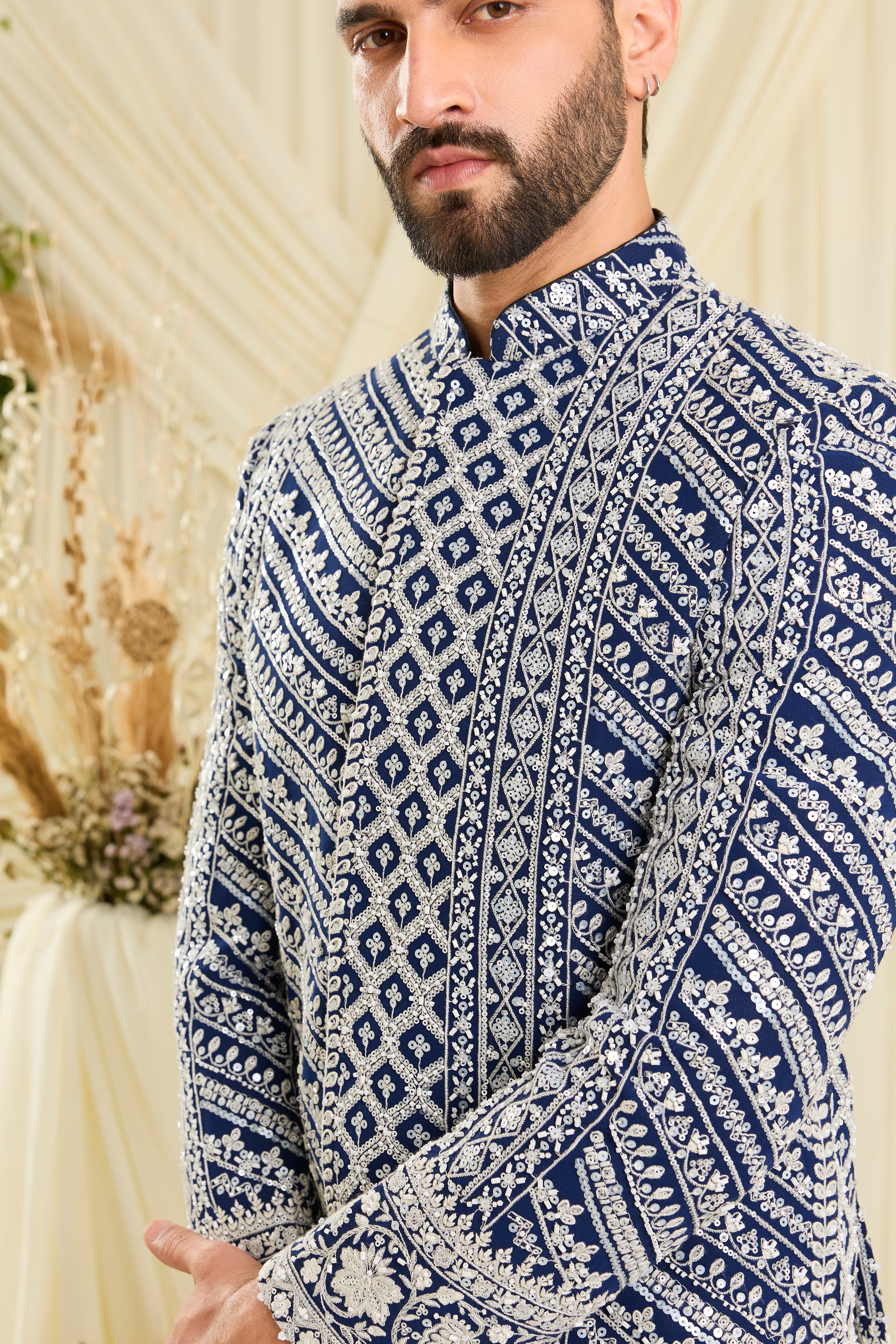 Royal blue bandgala with intricate white cut dana work and delicate sequins, crafted for a bold, ultra-luxurious statement.