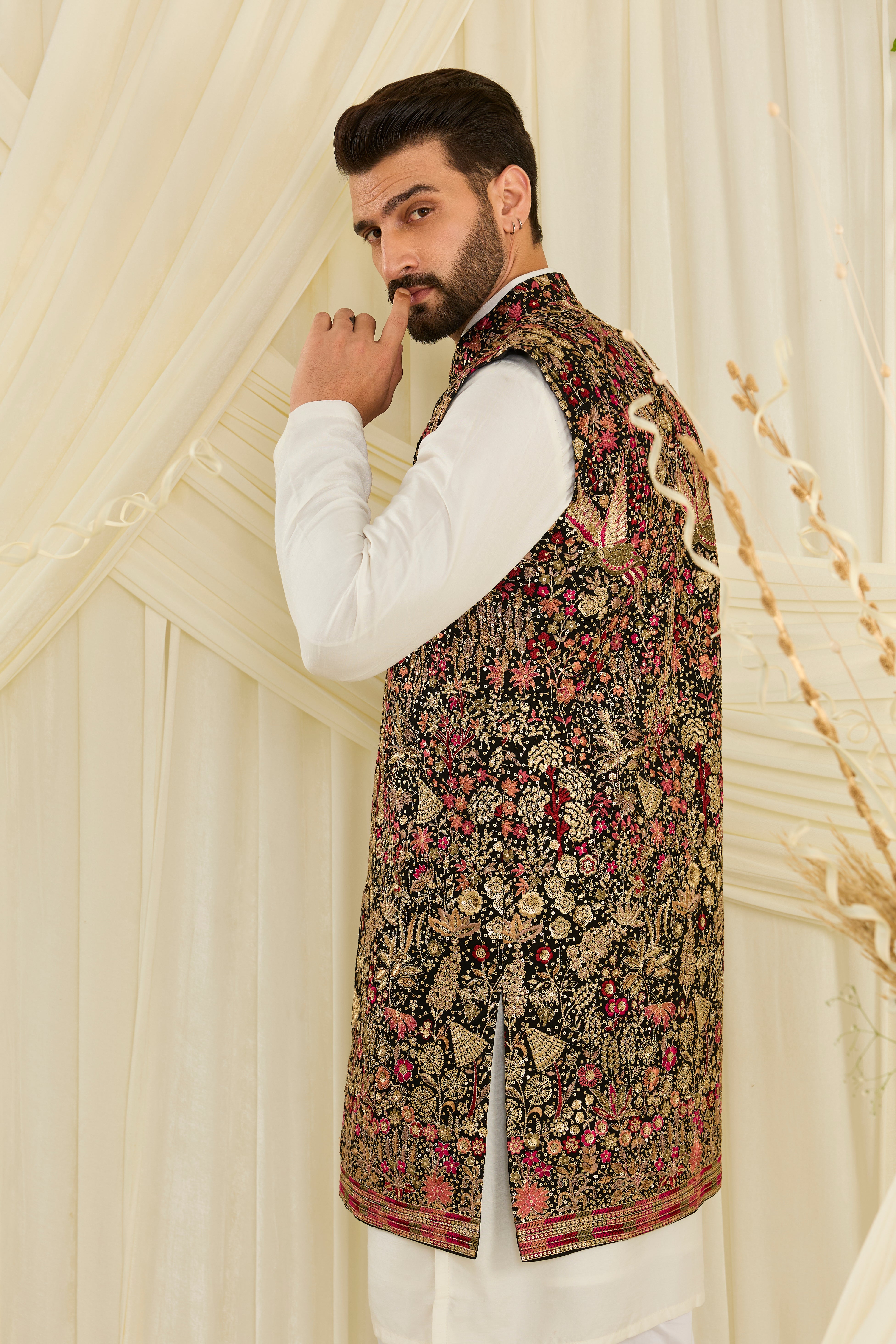 Black long open jacket with flora-fauna embroidery, multicolour threadwork, and delicate sequins for a rich, elevated couture statement.