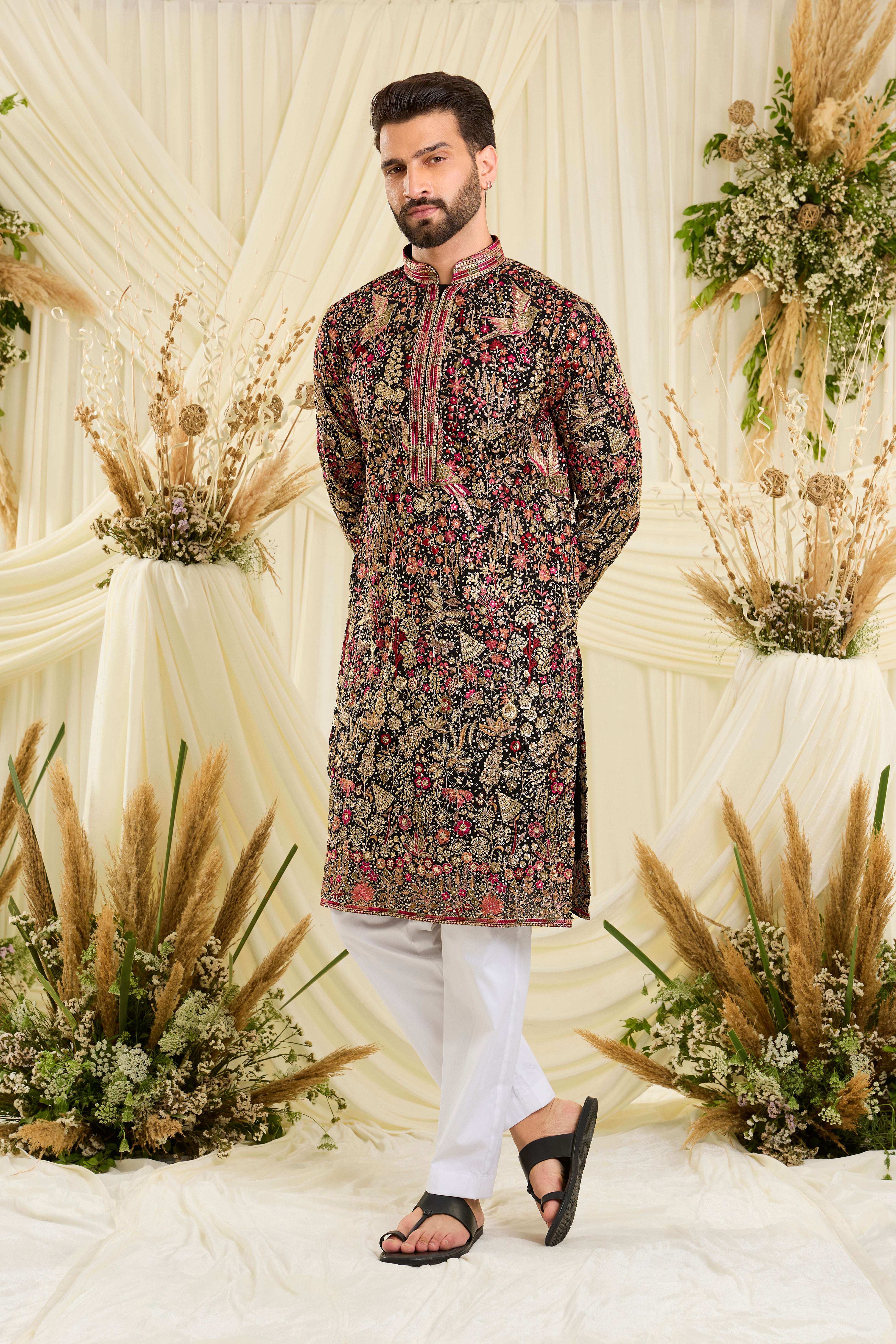 Black sequined kurta with intricate flora-fauna embroidery, multicolour threadwork, sequins, and a delicately detailed neckline for elevated festive elegance