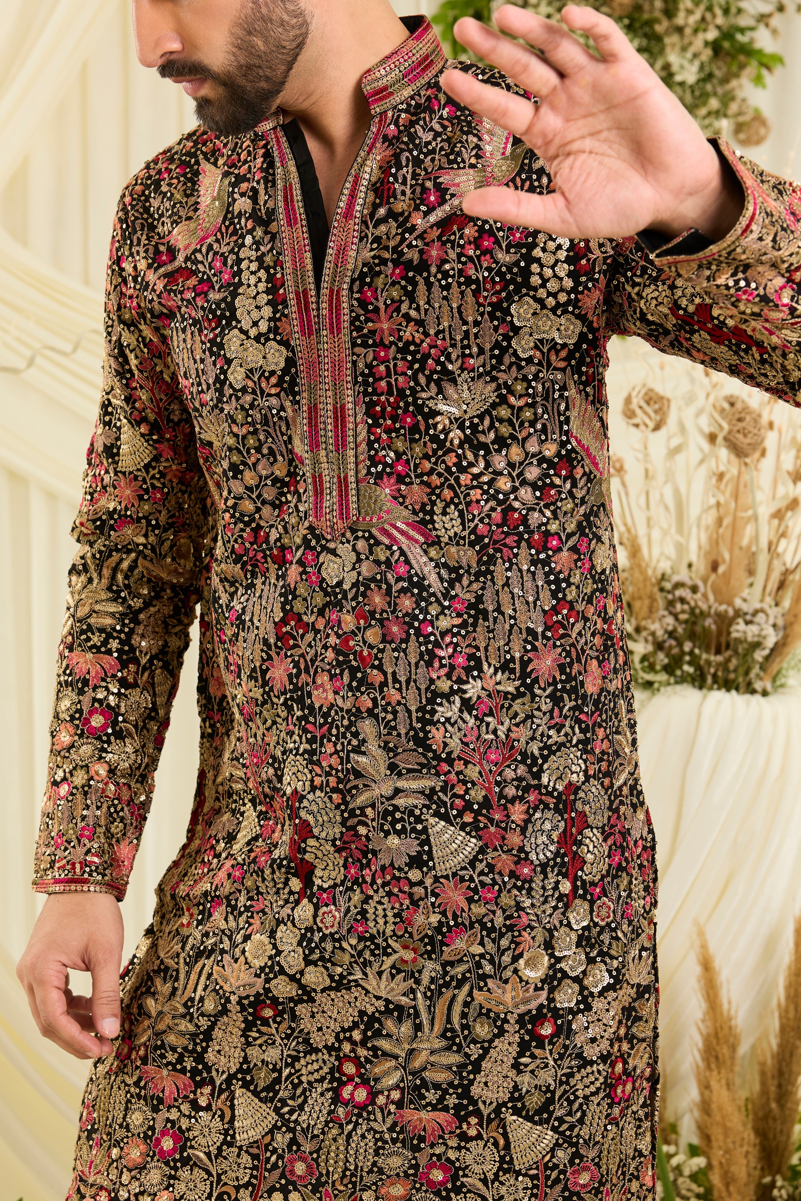 Black sequined kurta with intricate flora-fauna embroidery, multicolour threadwork, sequins, and a delicately detailed neckline for elevated festive elegance