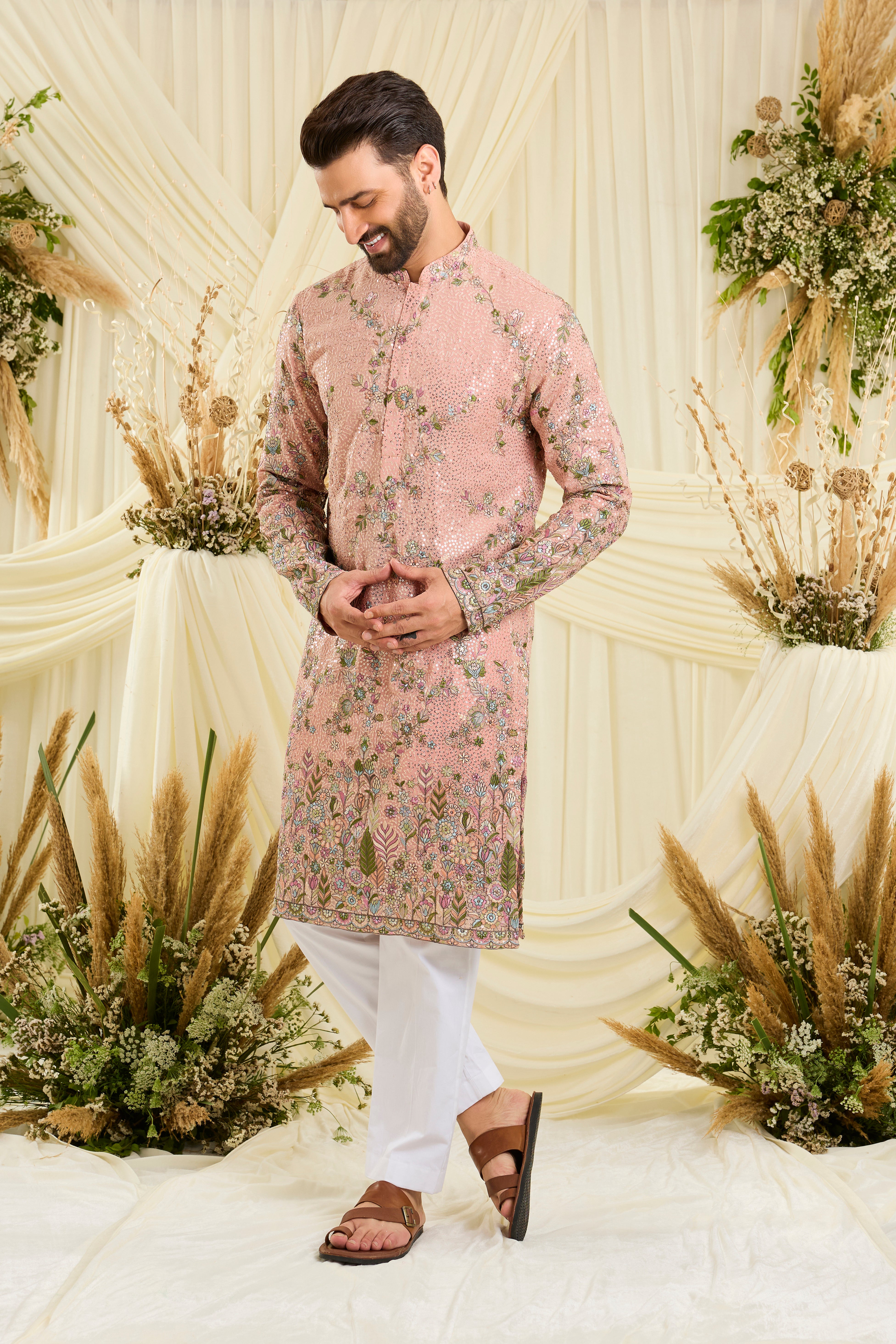 Light peach sequined kurta with intricate floral embroidery, multicolour threadwork, and delicate sequins for a fresh, elevated festive look.
