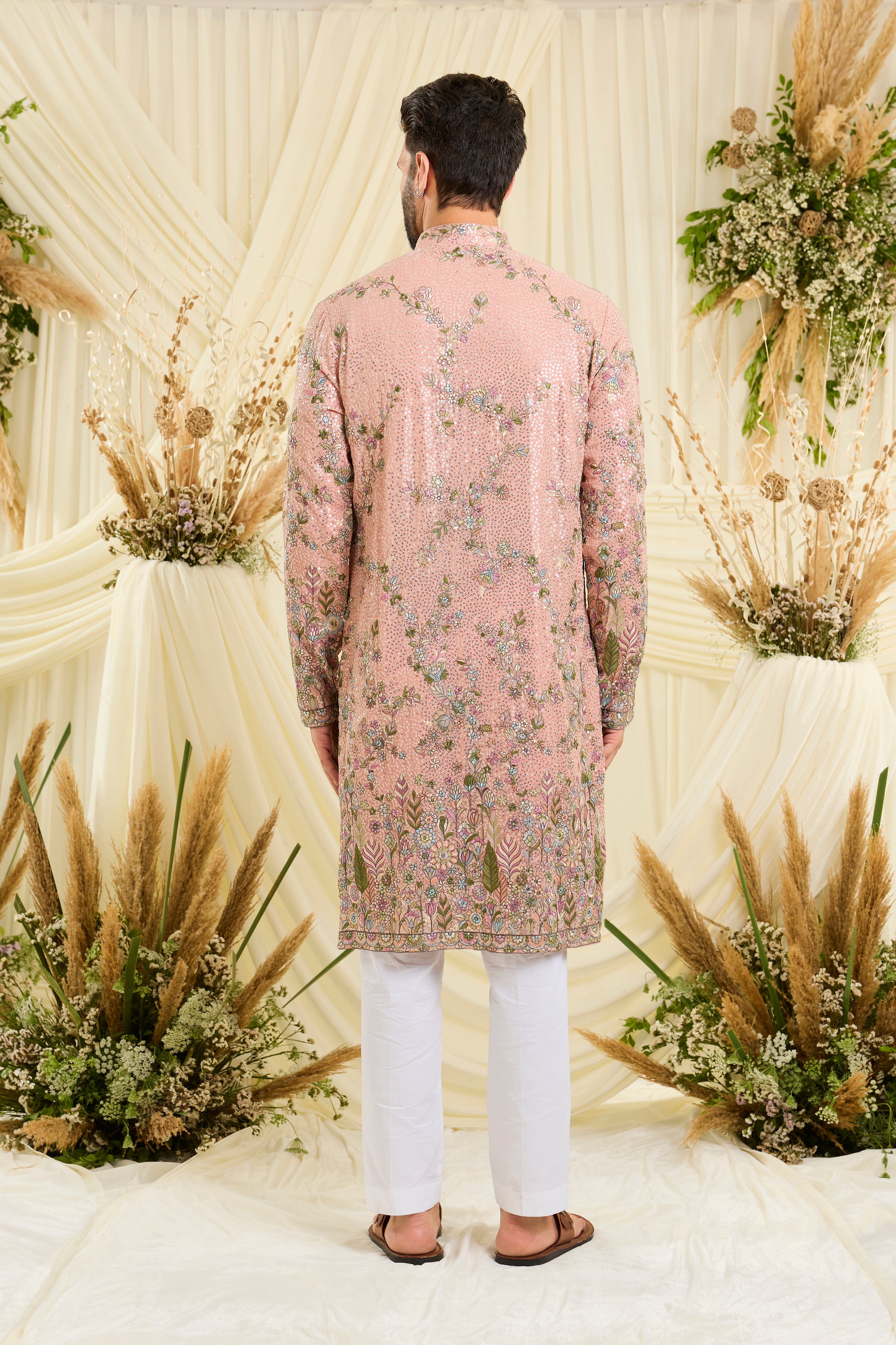 Light peach sequined kurta with intricate floral embroidery, multicolour threadwork, and delicate sequins for a fresh, elevated festive look.