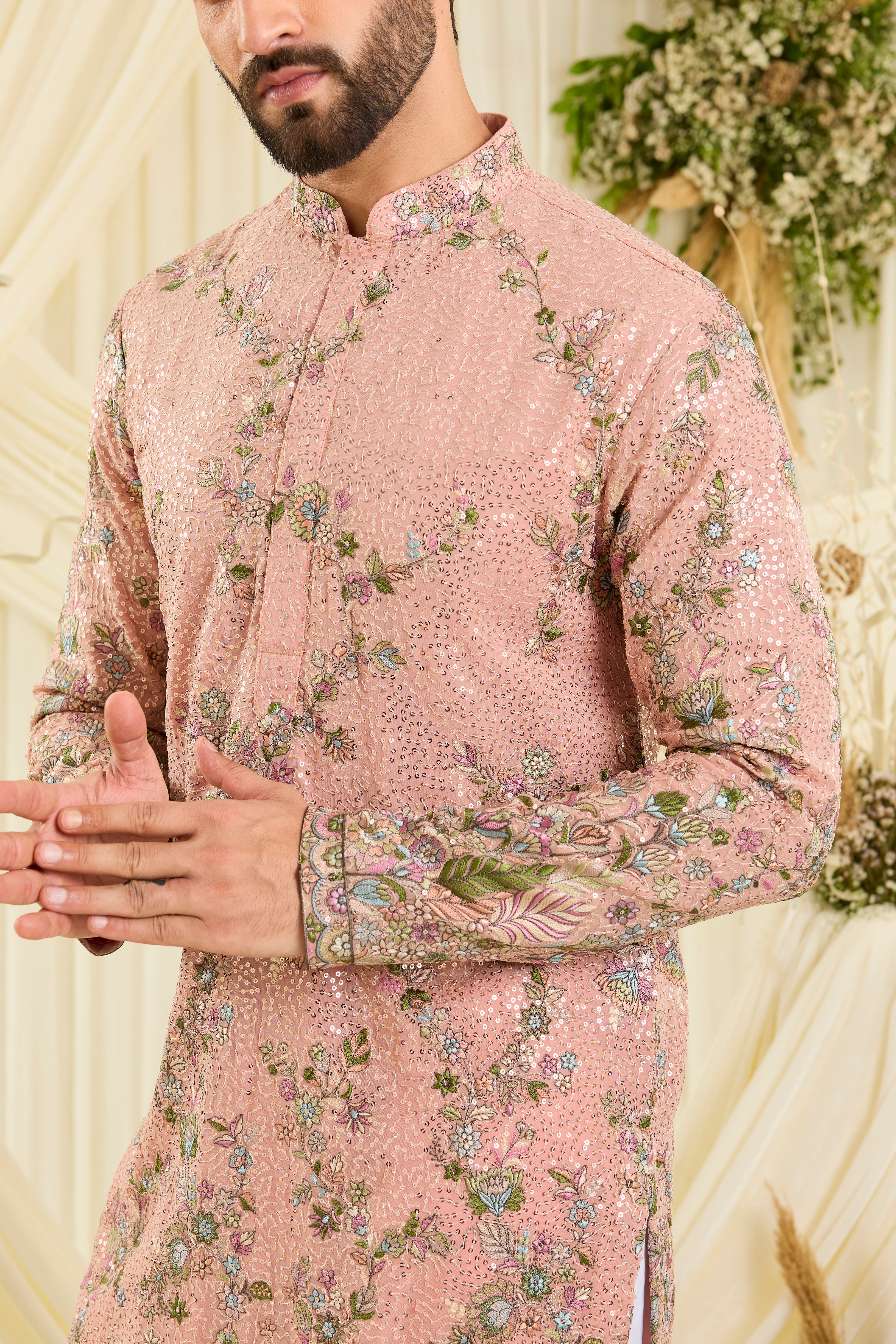 Light peach sequined kurta with intricate floral embroidery, multicolour threadwork, and delicate sequins for a fresh, elevated festive look.