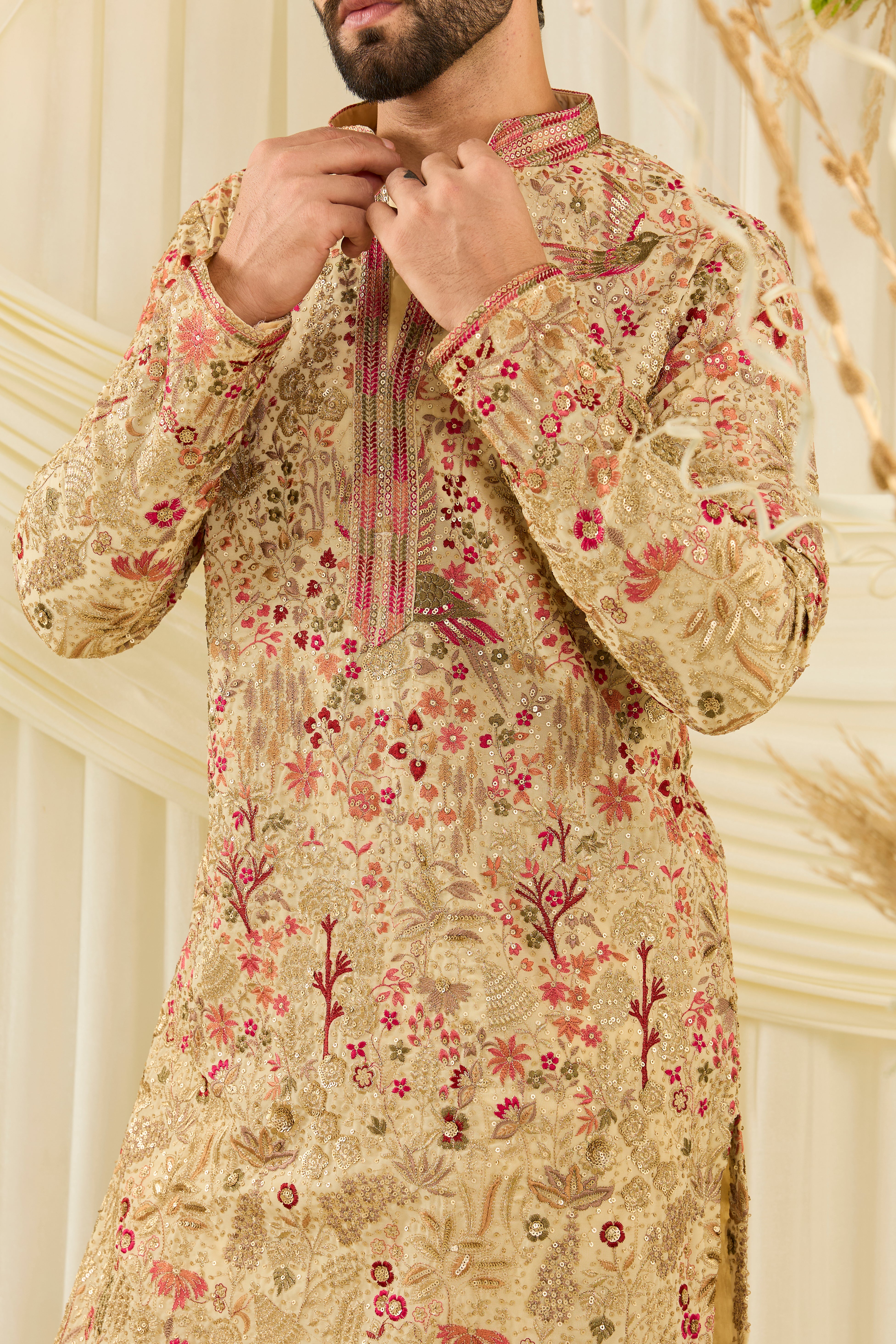 Cream- gold sequined kurta with intricate flora-fauna embroidery, multicolour threadwork, sequins, and a delicately detailed neckline for elevated festive elegance