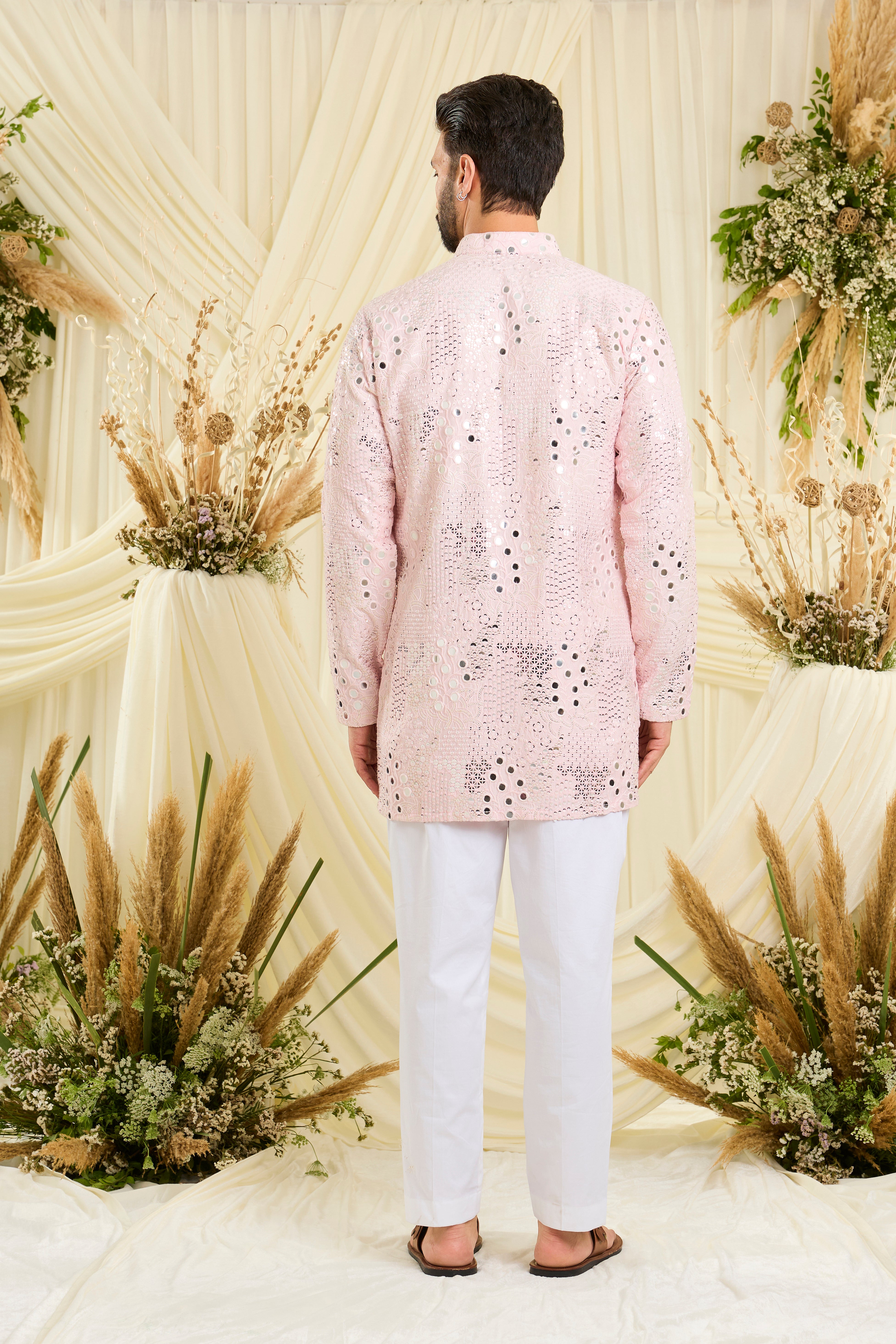 Baby pink mirrorwork kurta with floral threadwork and shimmering sequins — luminous, romantic, and crafted to stand out.
