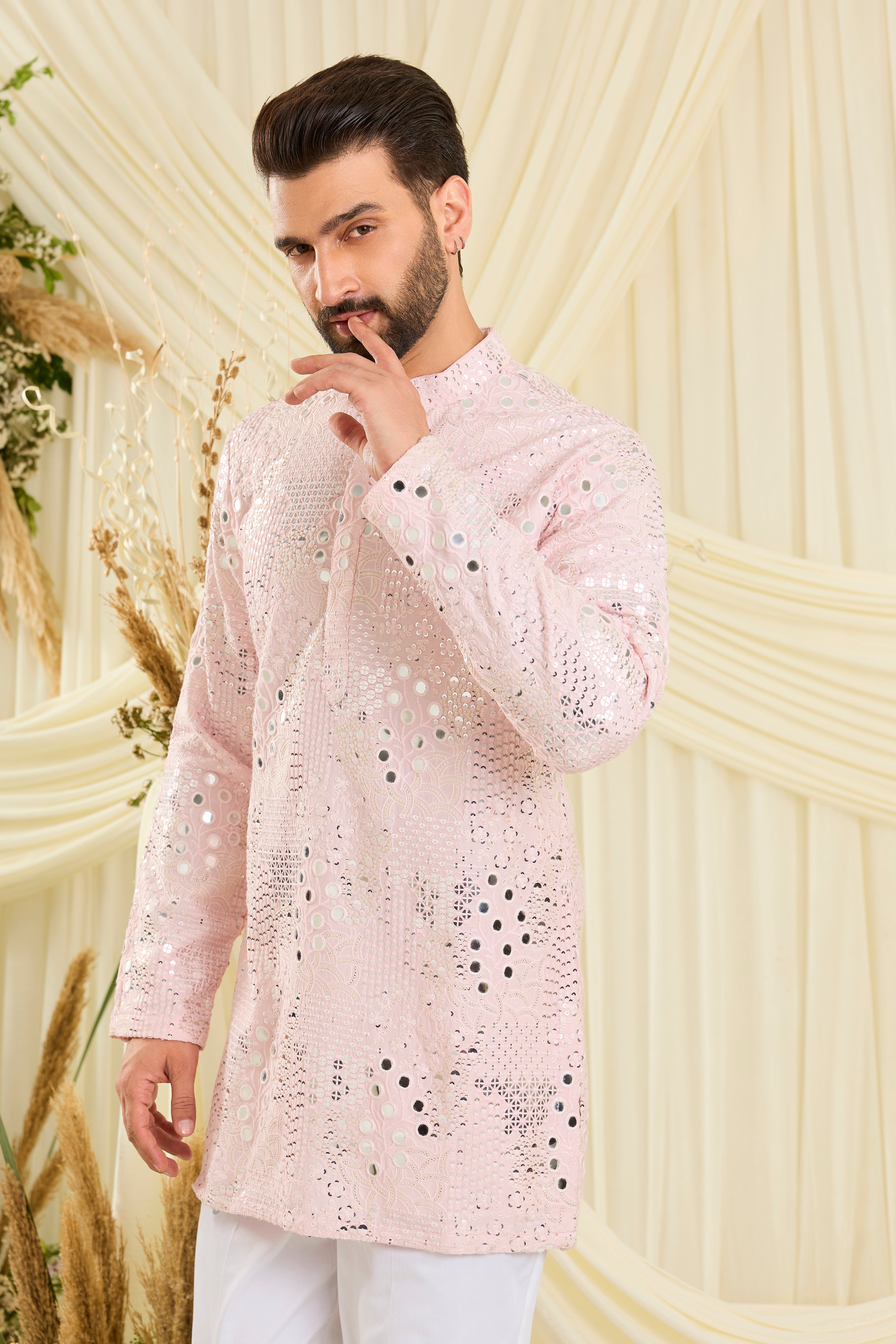 Baby pink mirrorwork kurta with floral threadwork and shimmering sequins — luminous, romantic, and crafted to stand out.