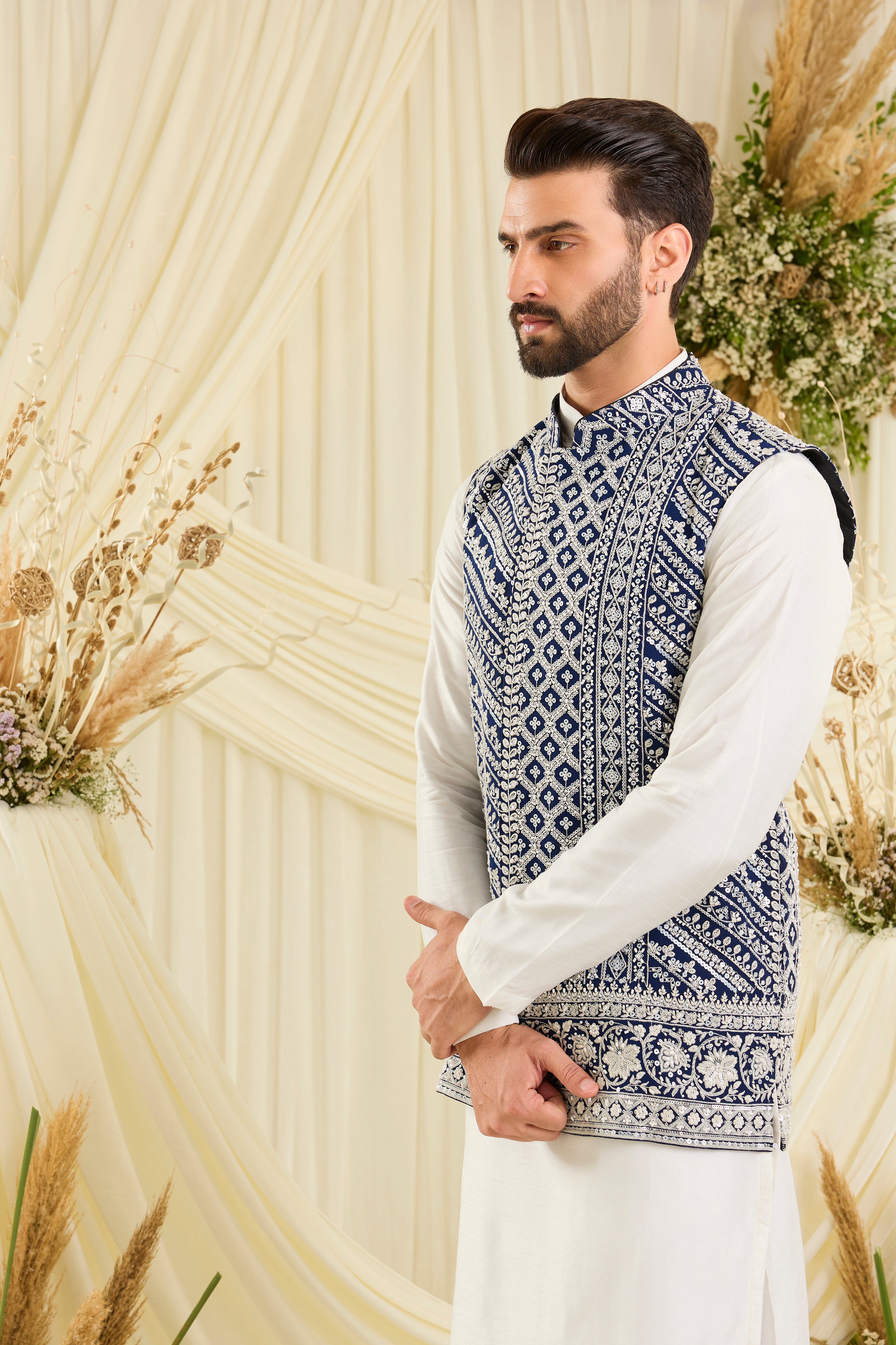 Royal blue nehru jacket with intricate white cut dana work and delicate sequins, crafted for a bold, ultra-luxurious statement.