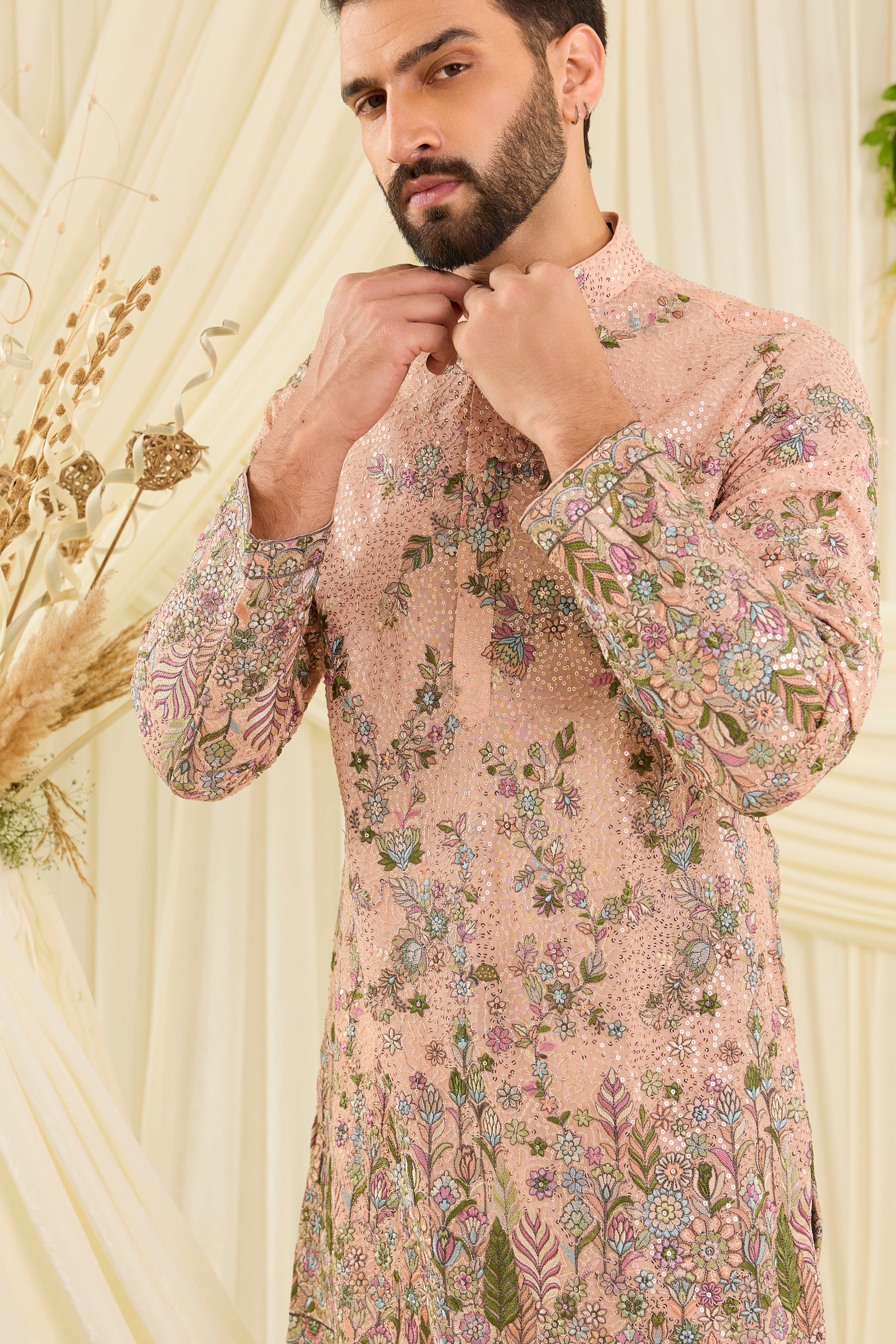 Peach sequined short kurta with intricate floral embroidery, multicolour threadwork, and delicate sequins for a fresh, elevated festive look.