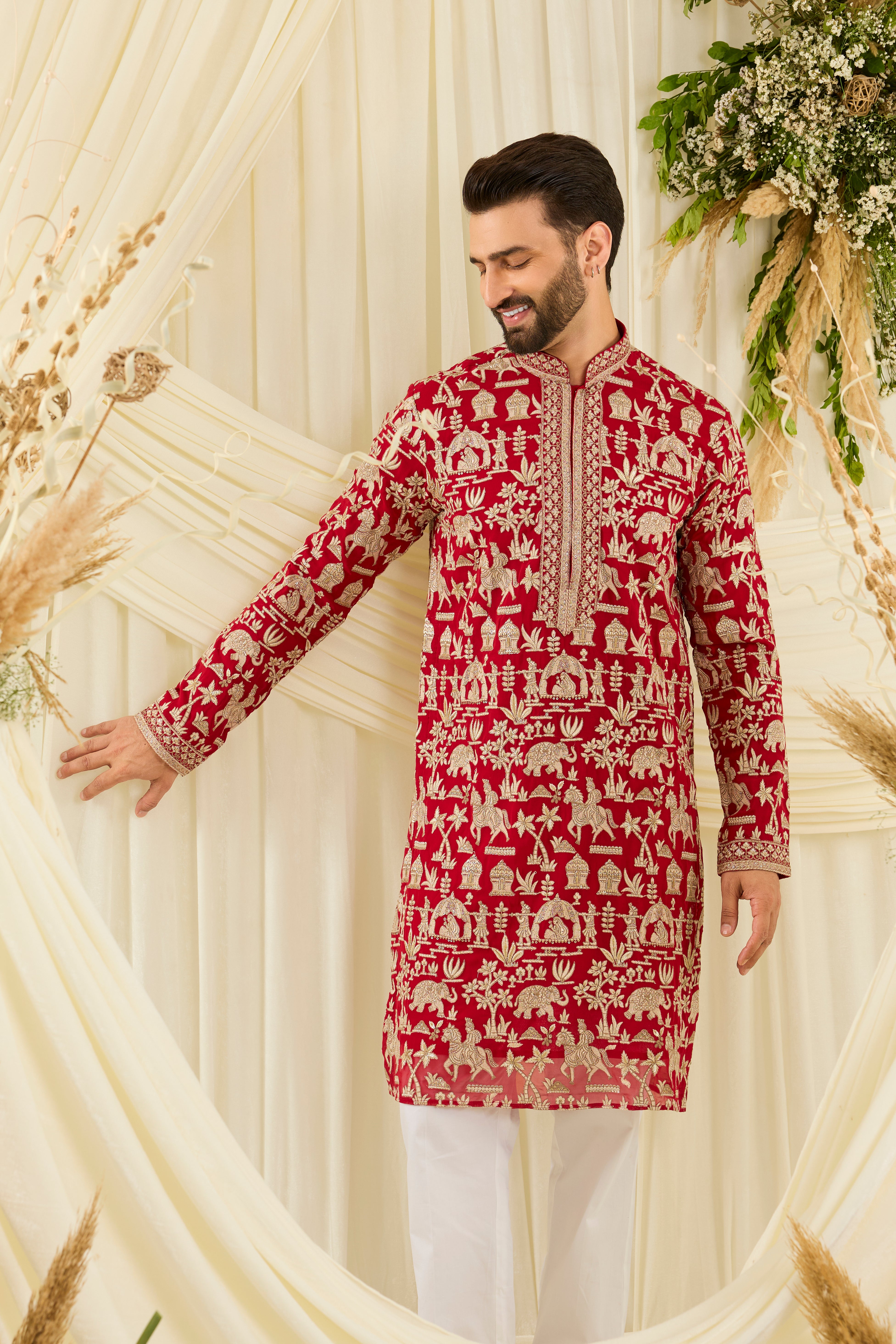 Red-pink Mughal era kurta with heavy zari work and a delicate neckline — regal, opulent, and timelessly refined