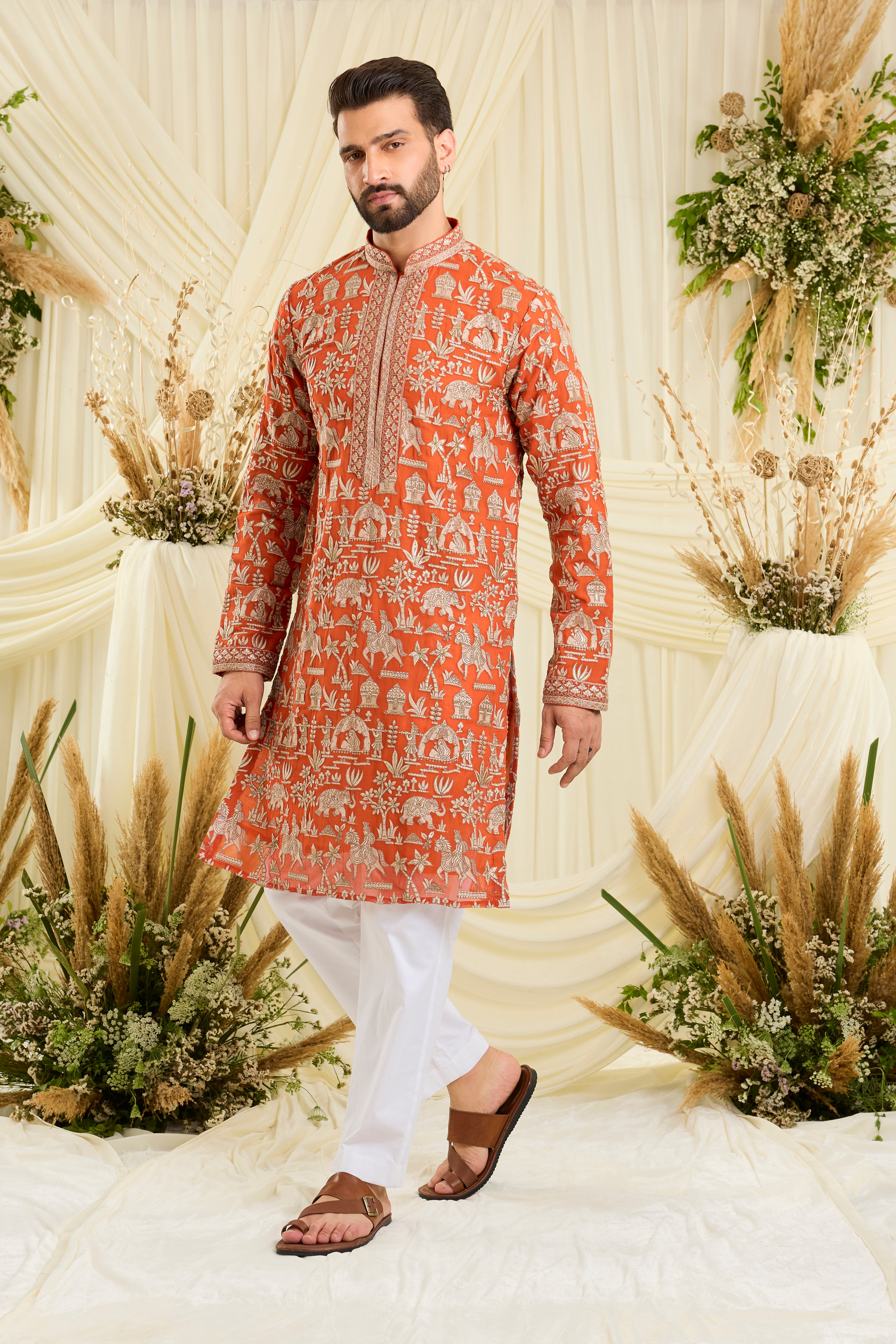 Orange Mughal era kurta with heavy zari work and a delicate neckline — regal, opulent, and timelessly refined