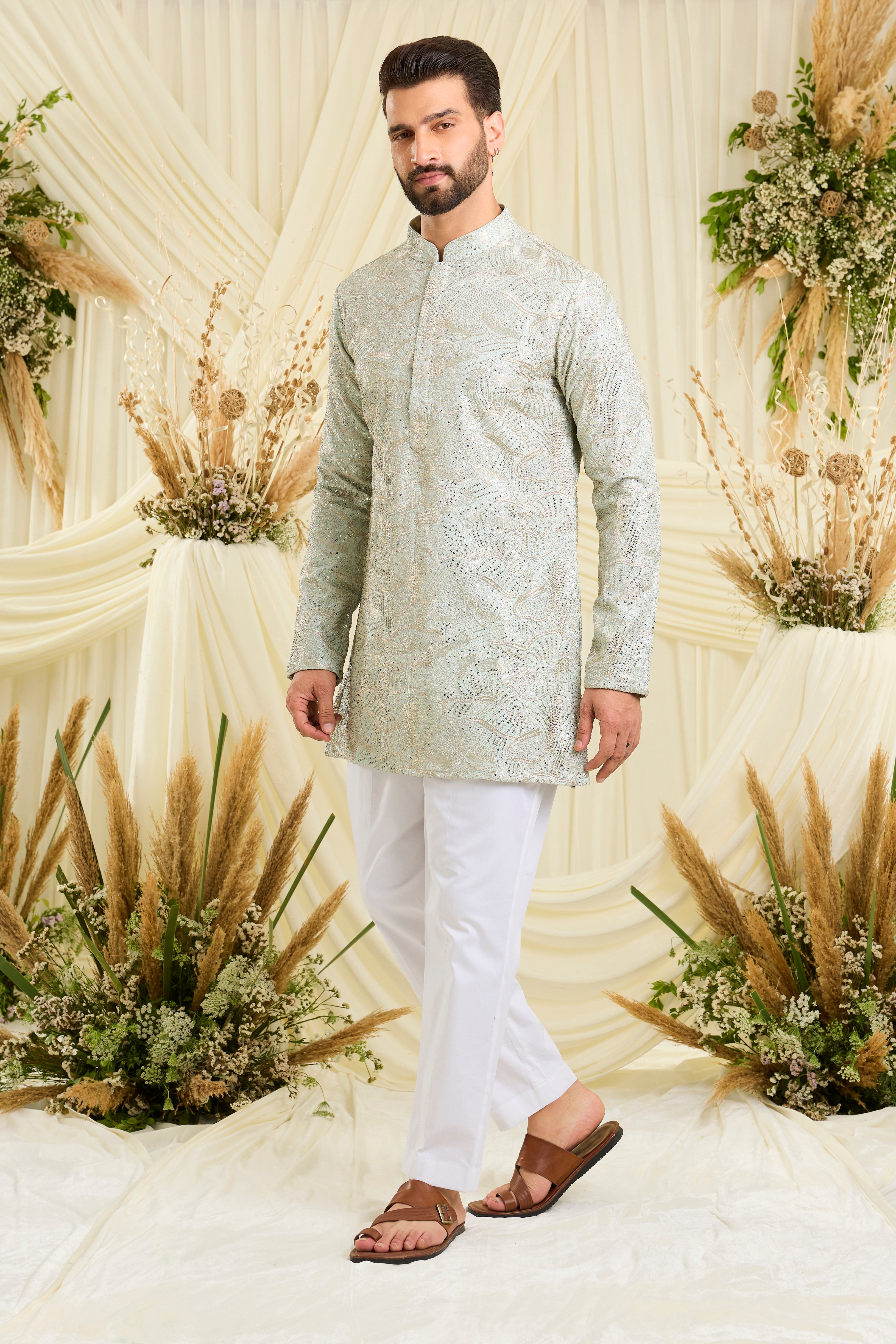 Pastel aqua blue sequined short kurta with an abstract design — fresh, luminous, and perfect for elevated day occasions.