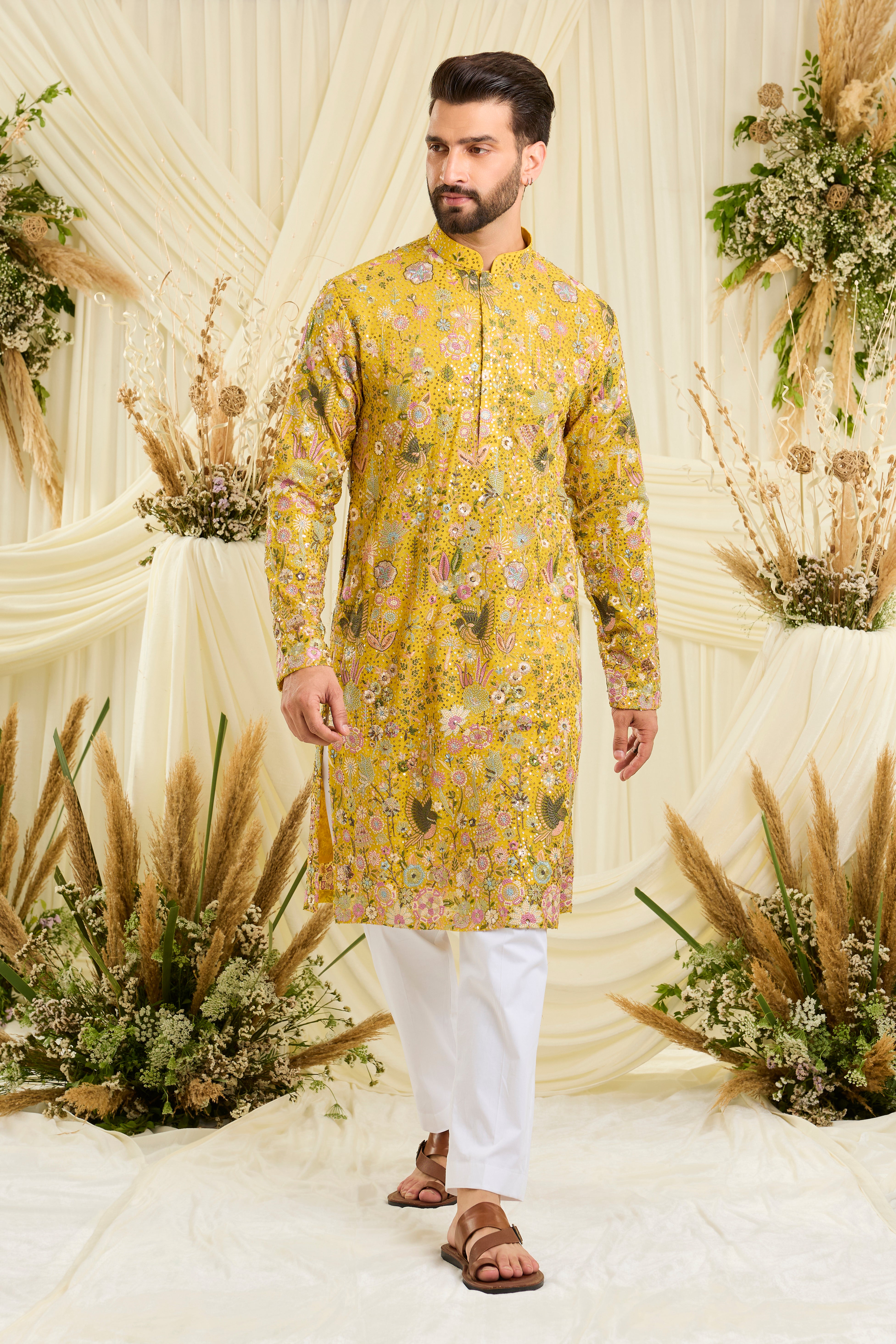 Yellow sequined kurta with intricate flora-fauna embroidery, multicolour threadwork, and detailed sequins for a fresh, elevated festive look.