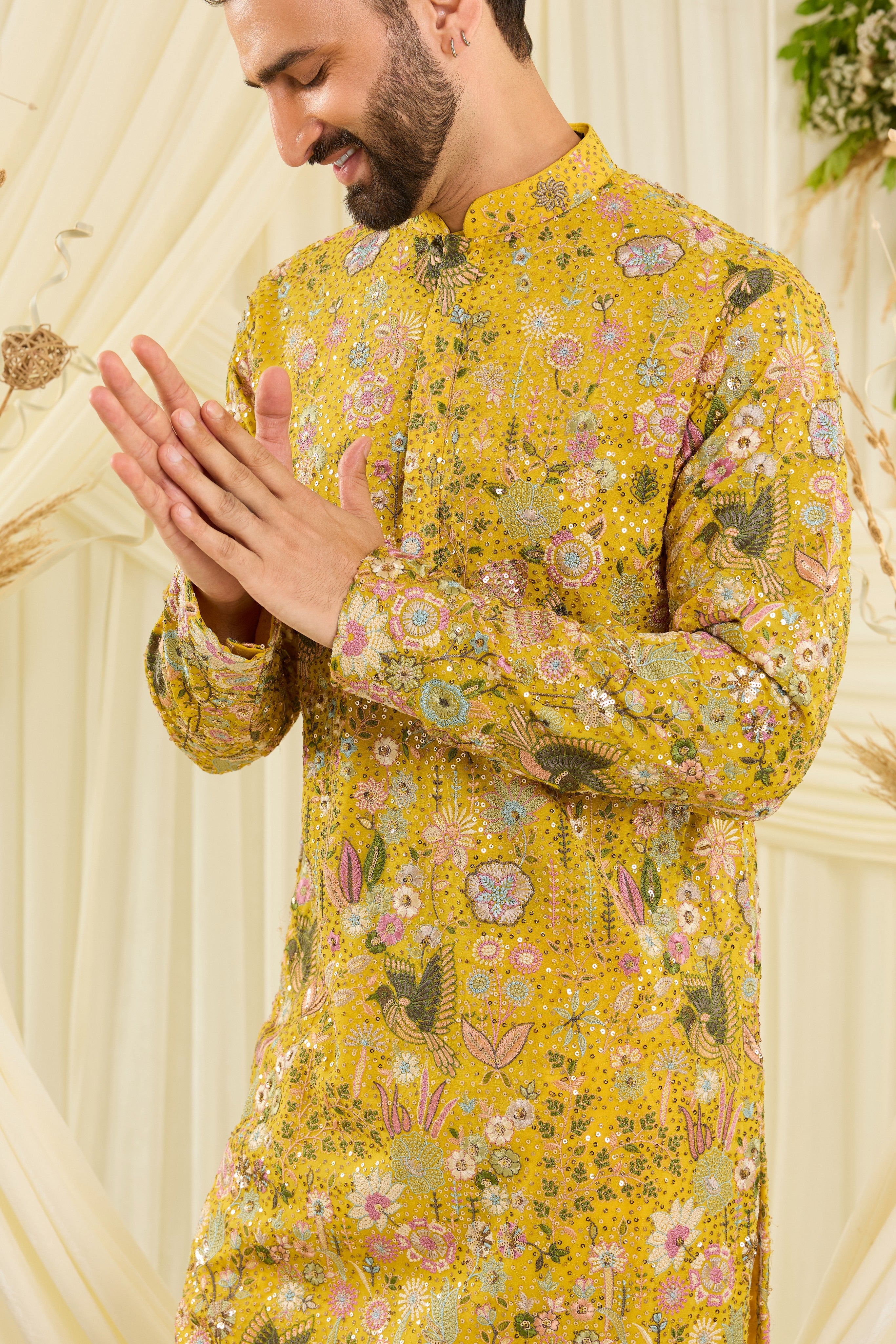 Yellow sequined kurta with intricate flora-fauna embroidery, multicolour threadwork, and detailed sequins for a fresh, elevated festive look.