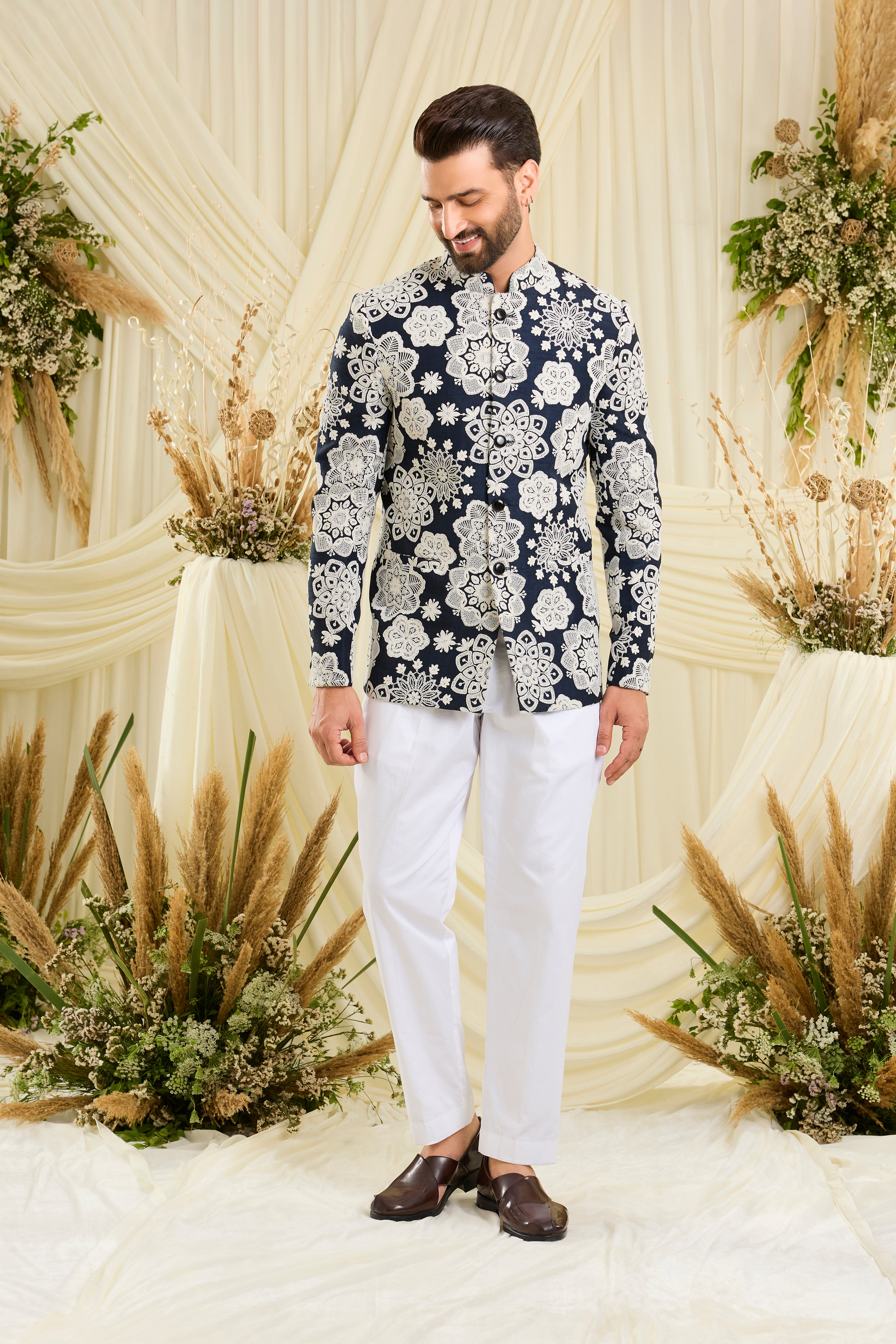 Red bandgala with intricate floral embroidery and heavy dori work, delivering a richly textured, bold festive statement.