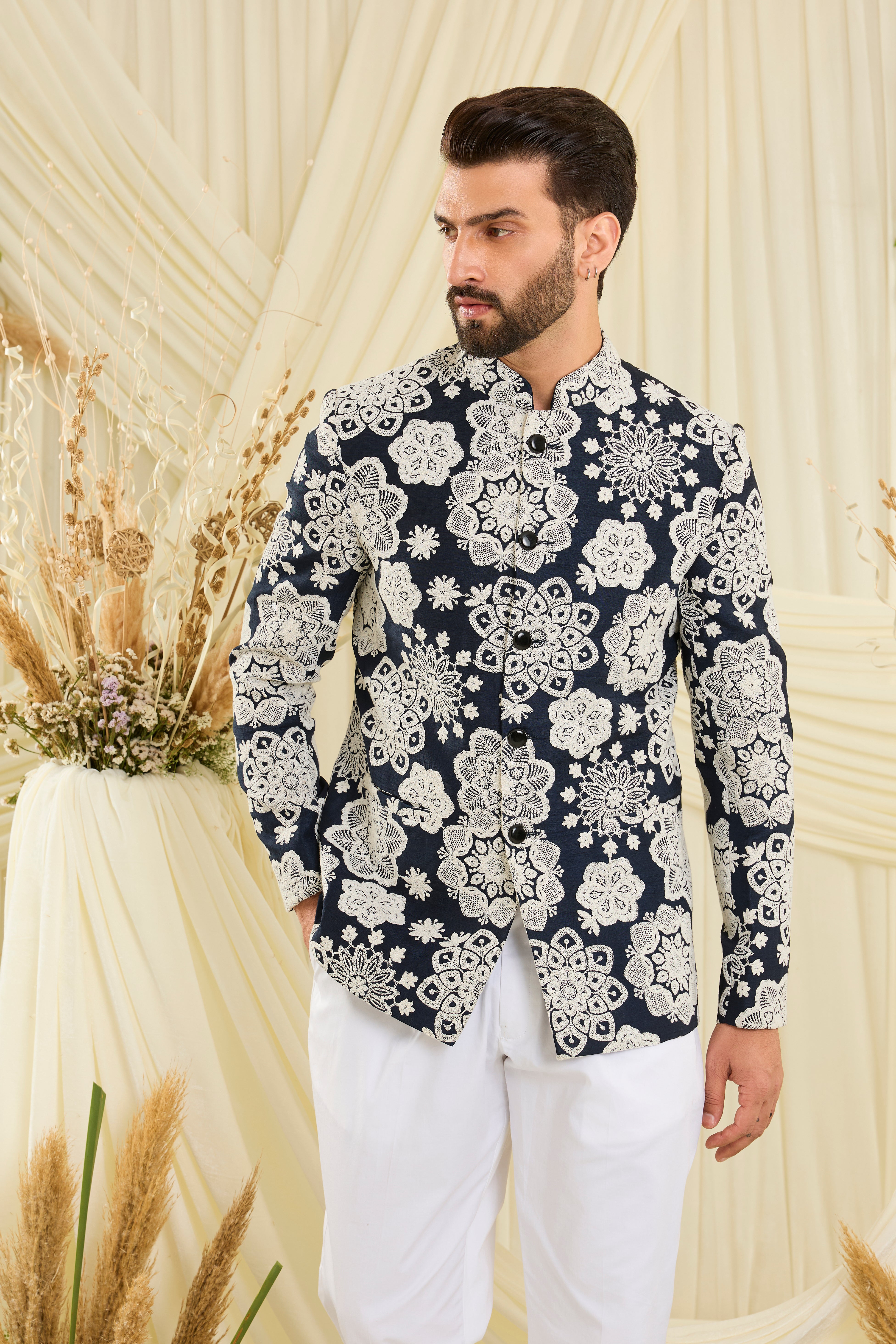 Red bandgala with intricate floral embroidery and heavy dori work, delivering a richly textured, bold festive statement.