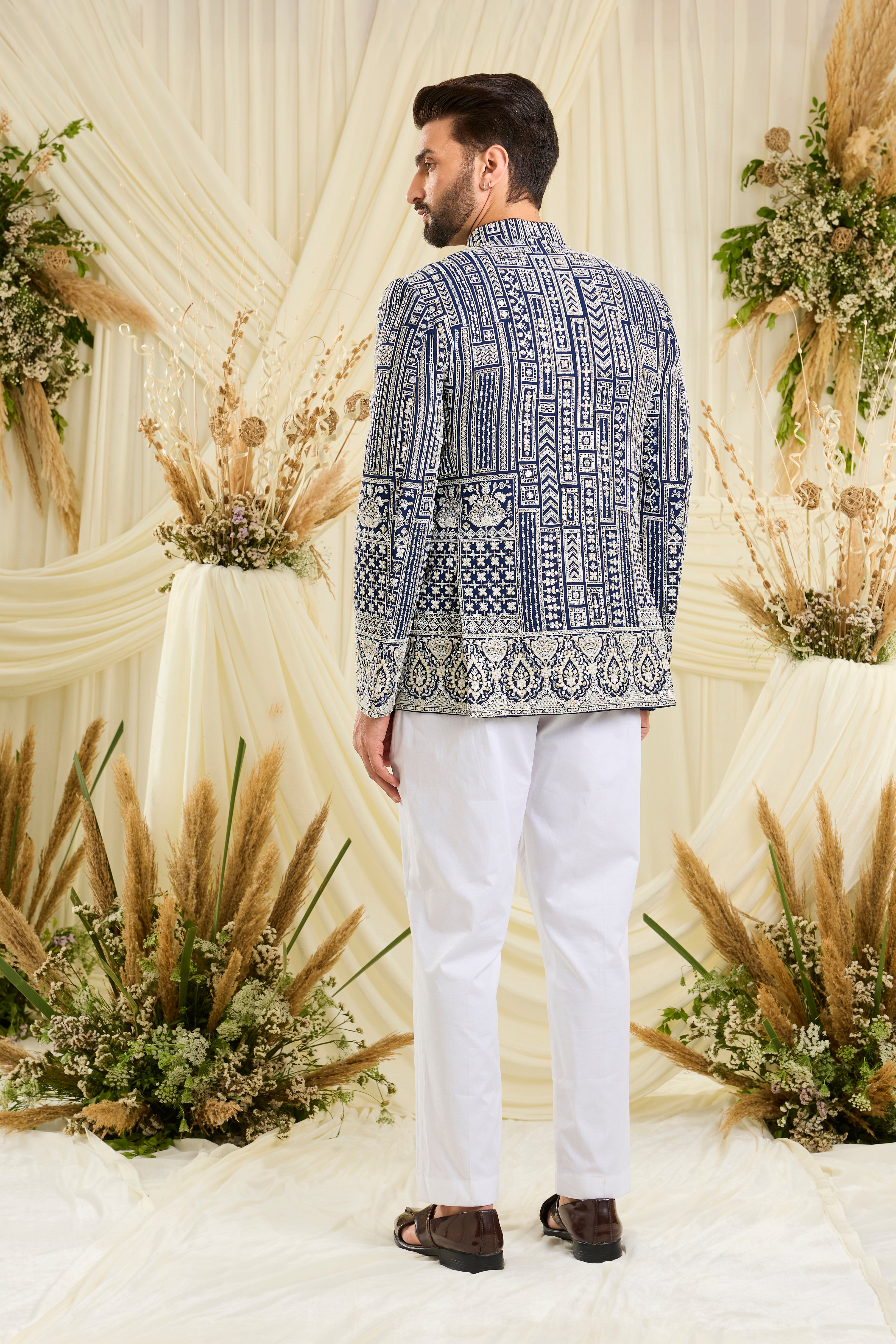 Royal blue bandgala with intricate white cut dana work and delicate sequins, crafted for a bold, ultra-luxurious statement.