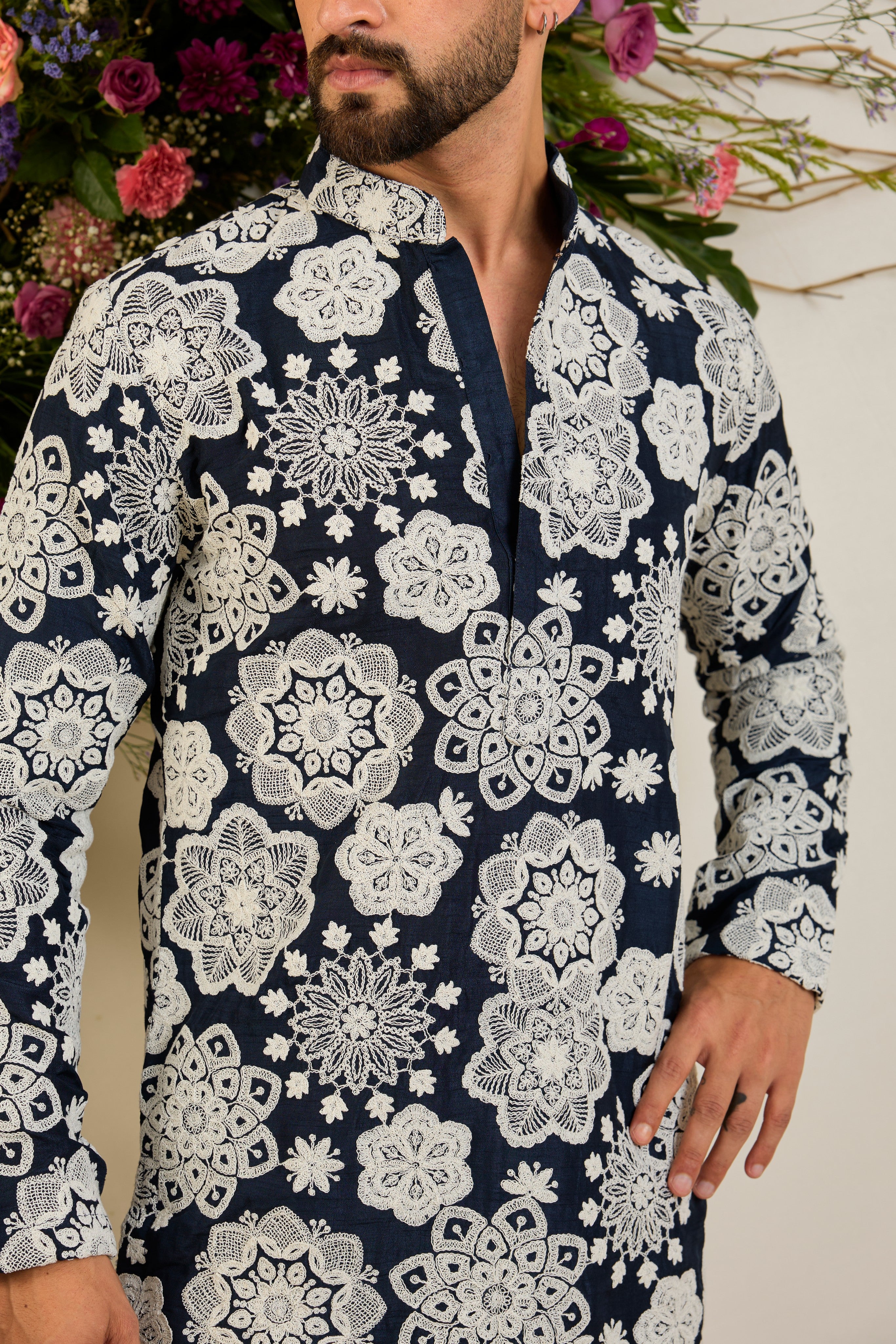 Navy blue silk kurta with radiant floral dori embroidery, tailored for timeless sophistication and distinguished elegance.