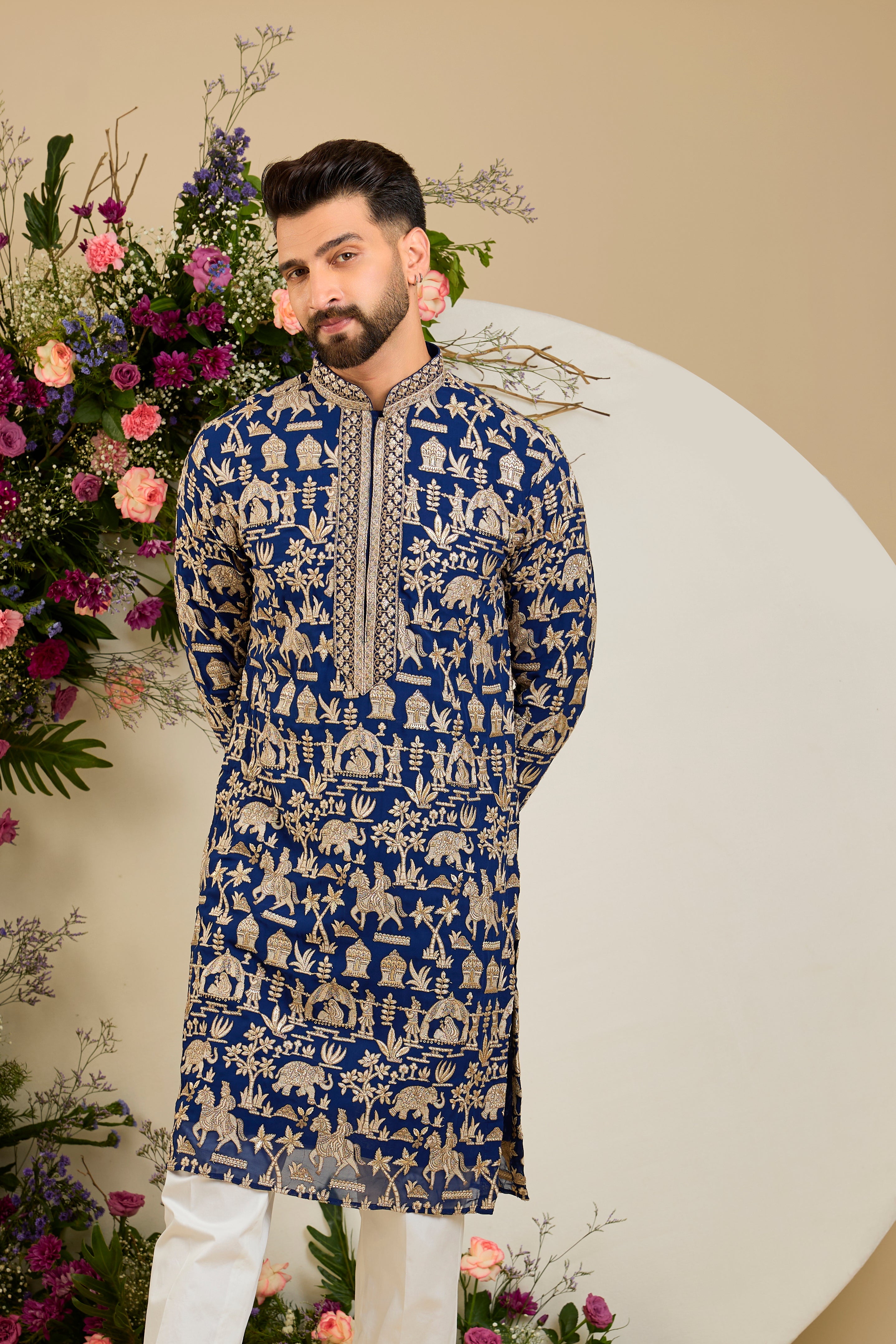 Royal blue kurta with Mughal-era embroidery, opulent zari work, sequins, and a refined neckline for timeless grandeur