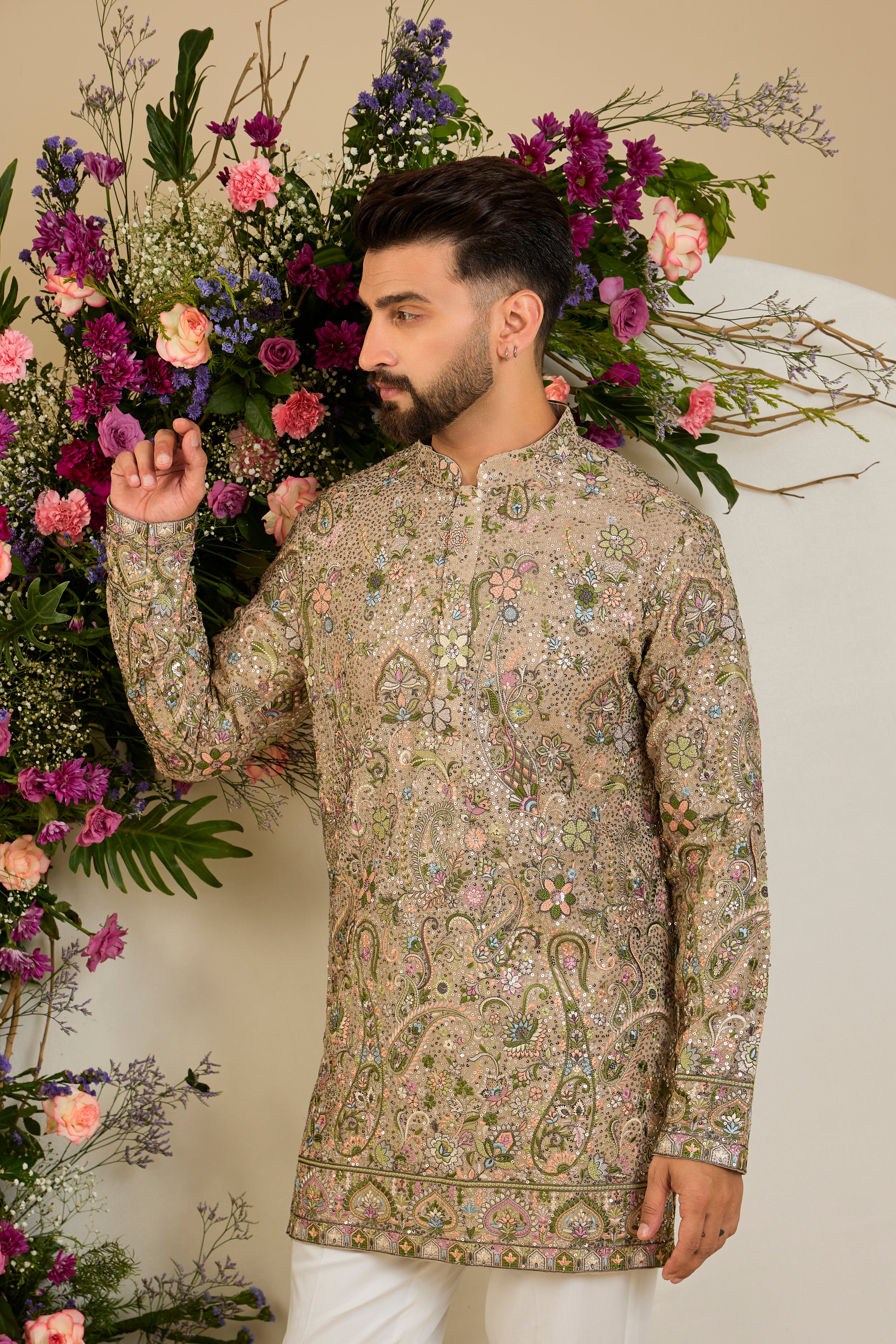 Heavy sequined kurta with floral embroidery in mouse shade , vibrant threadwork, and intricate paisley motifs for exceptional occasion dressing.