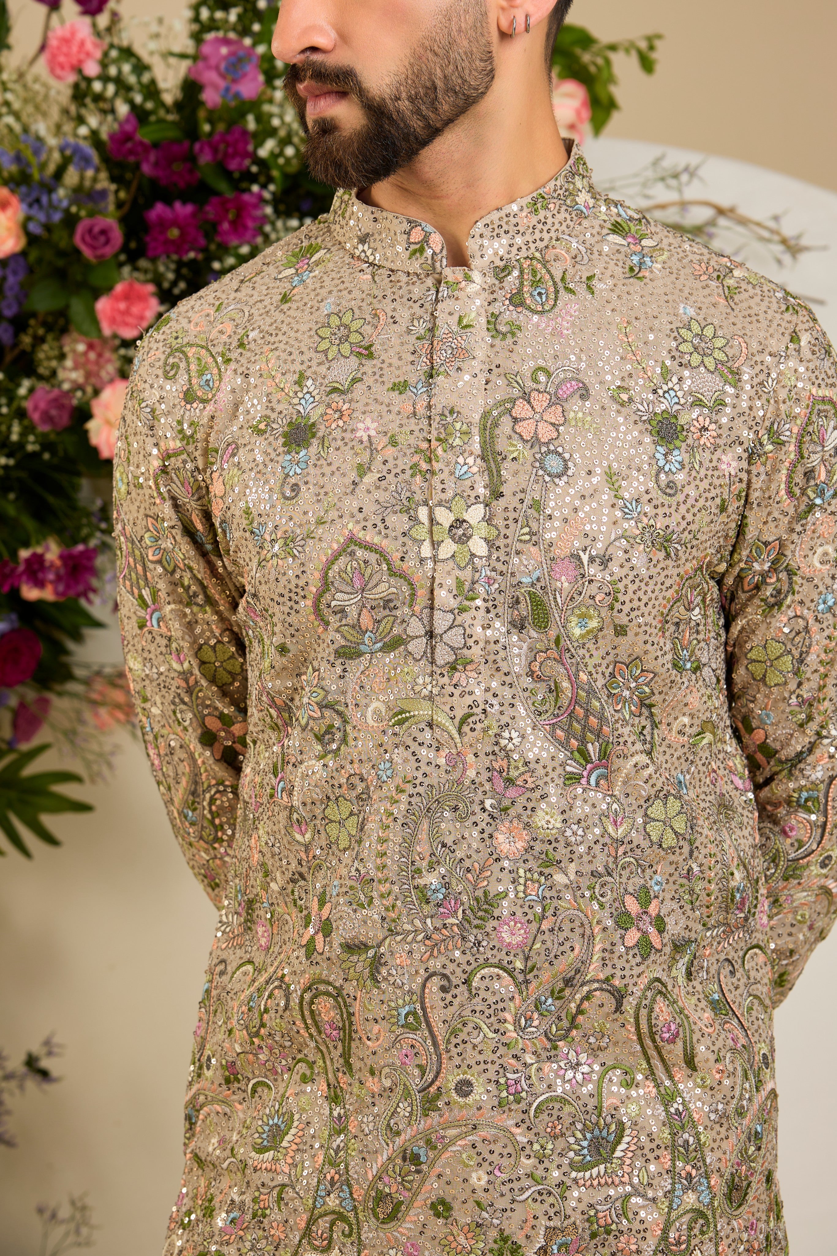 Heavy sequined kurta with floral embroidery in mouse shade , vibrant threadwork, and intricate paisley motifs for exceptional occasion dressing.