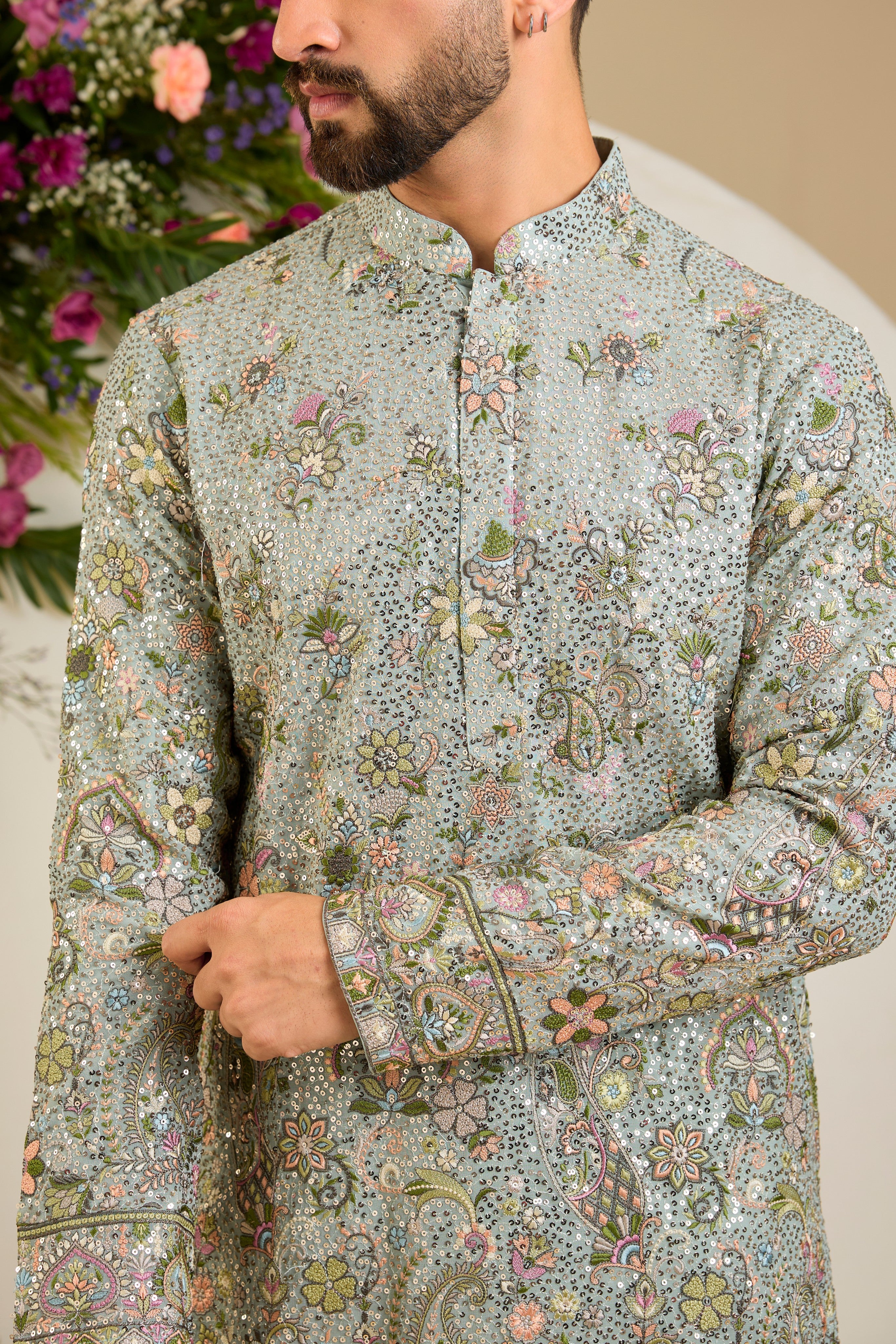 Aqua blue fully sequined kurta with intricate multi-coloured thread embroidery, tailored for distinguished celebrations and timeless elegance.
