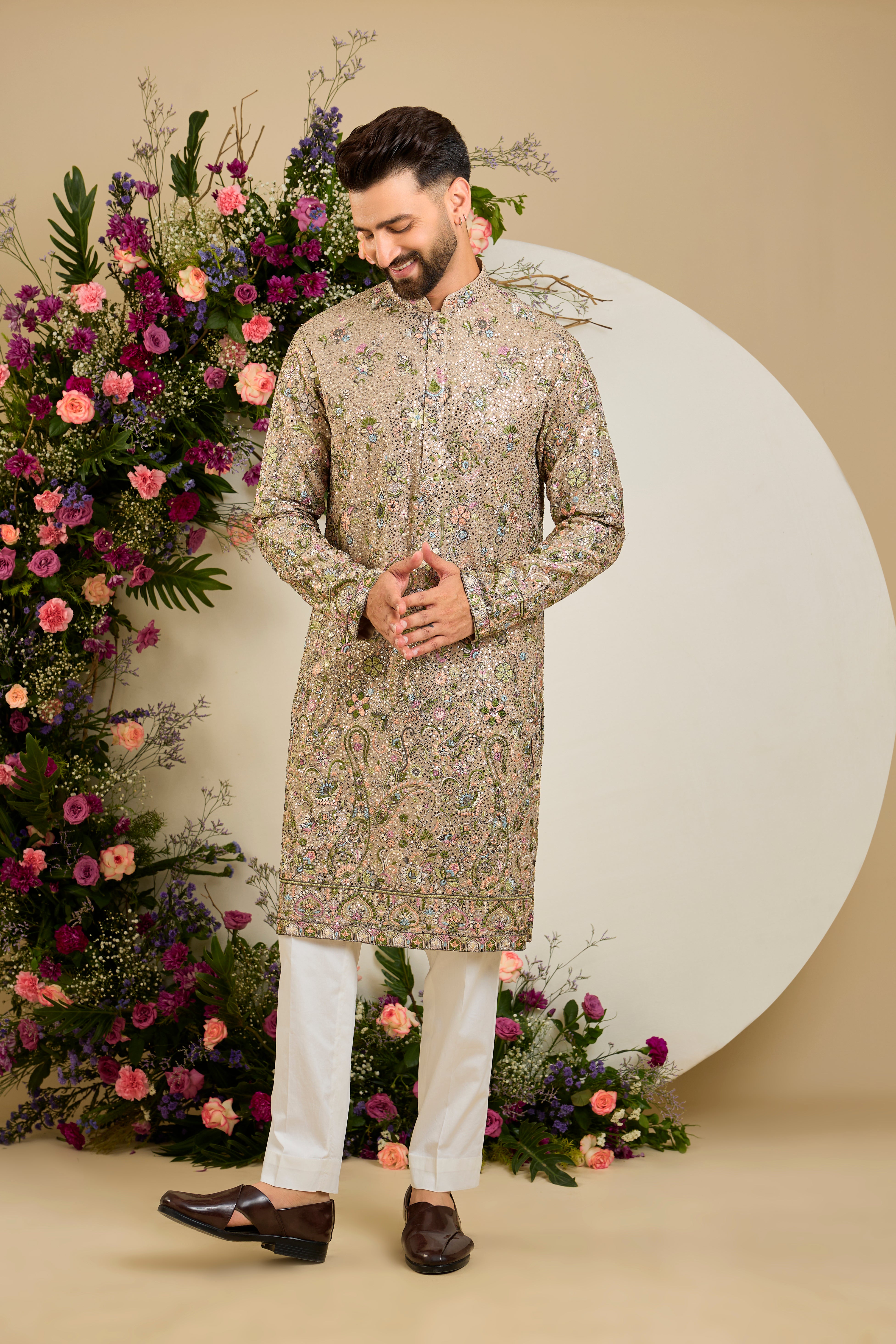 Heavy sequined mouse shaded kurta with intricate multi-coloured thread embroidery, tailored for distinguished celebrations and timeless elegance.