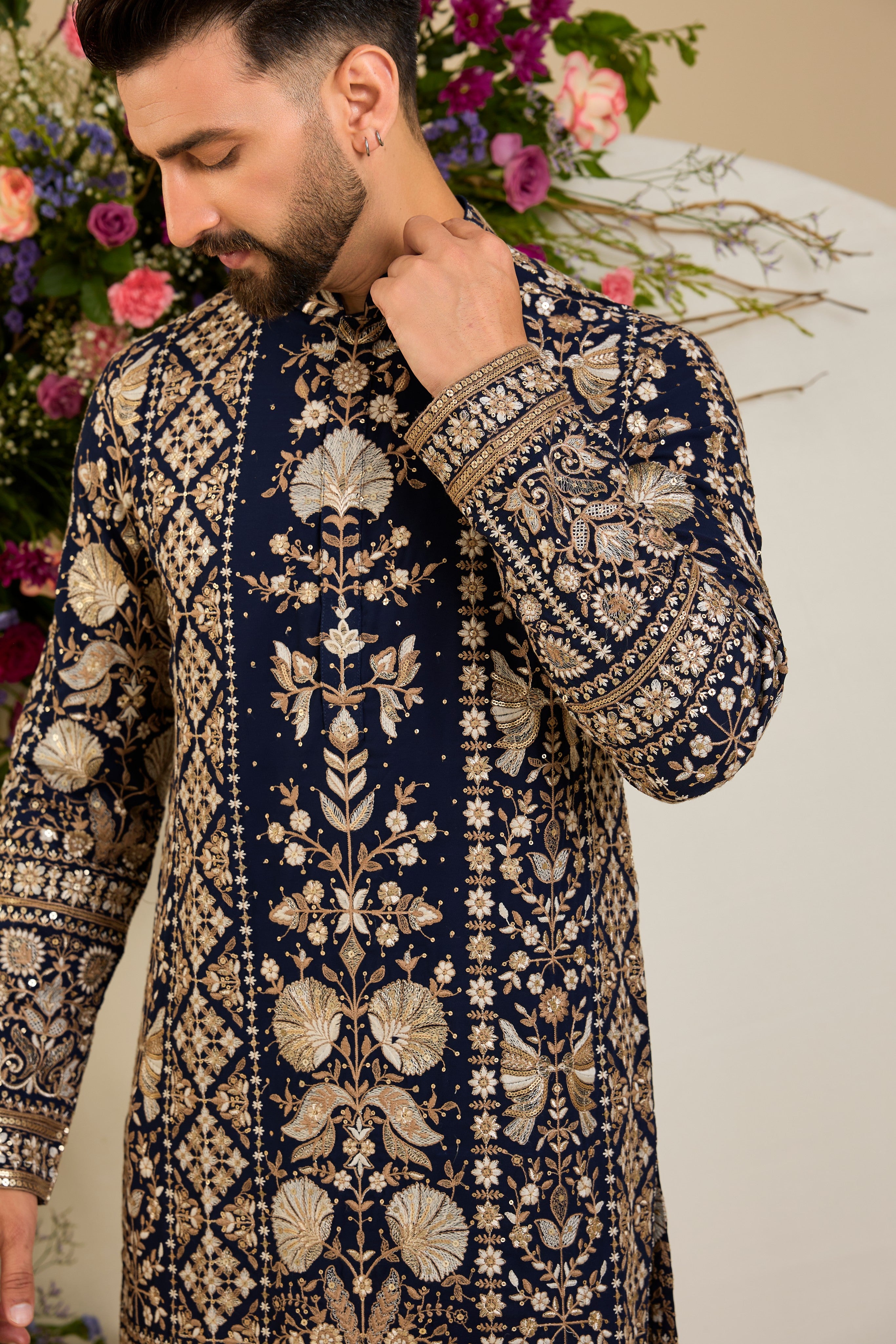 Navy blue floral kurta with intricate sequin and zari detailing, tailored for timeless elegance and distinguished celebrations.