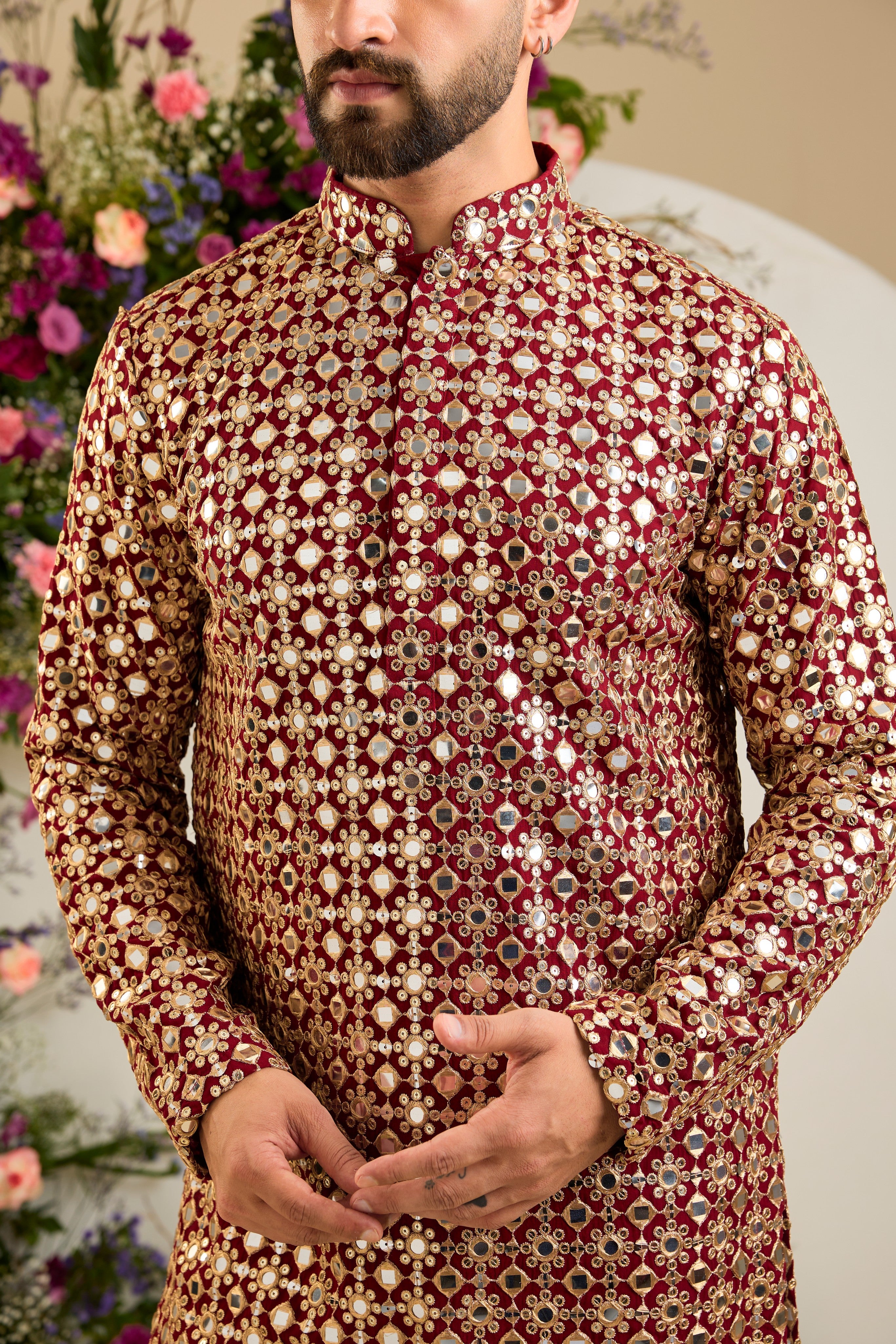 Imperial maroon mirror-inspired sequin kurta with rich zari detailing, crafted for distinguished celebrations and enduring elegance.