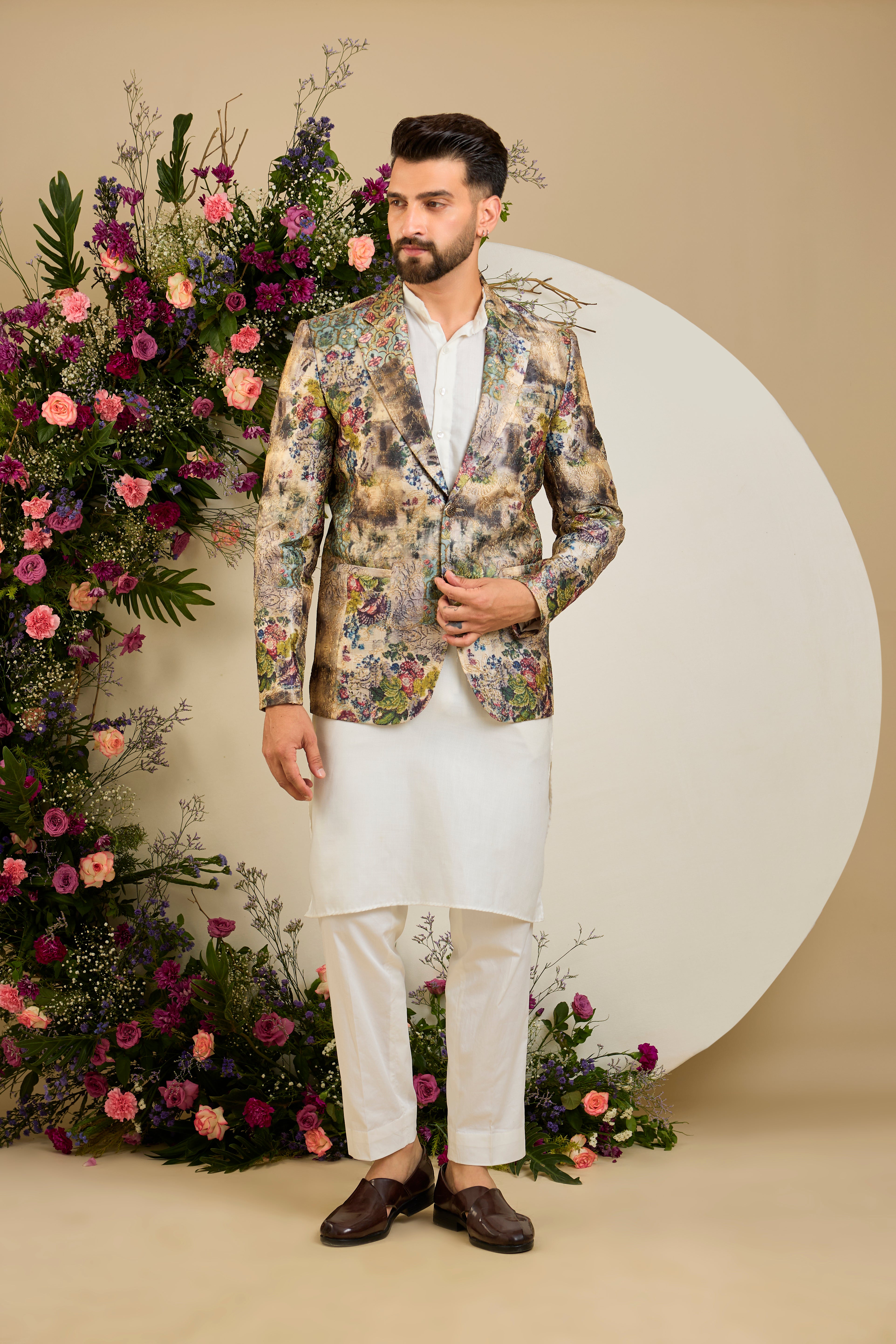 Showcasing a vibrant multi-coloured floral backdrop, this blazer is elevated with refined aari craftsmanship .An exceptional expression of contemporary couture and timeless elegance.