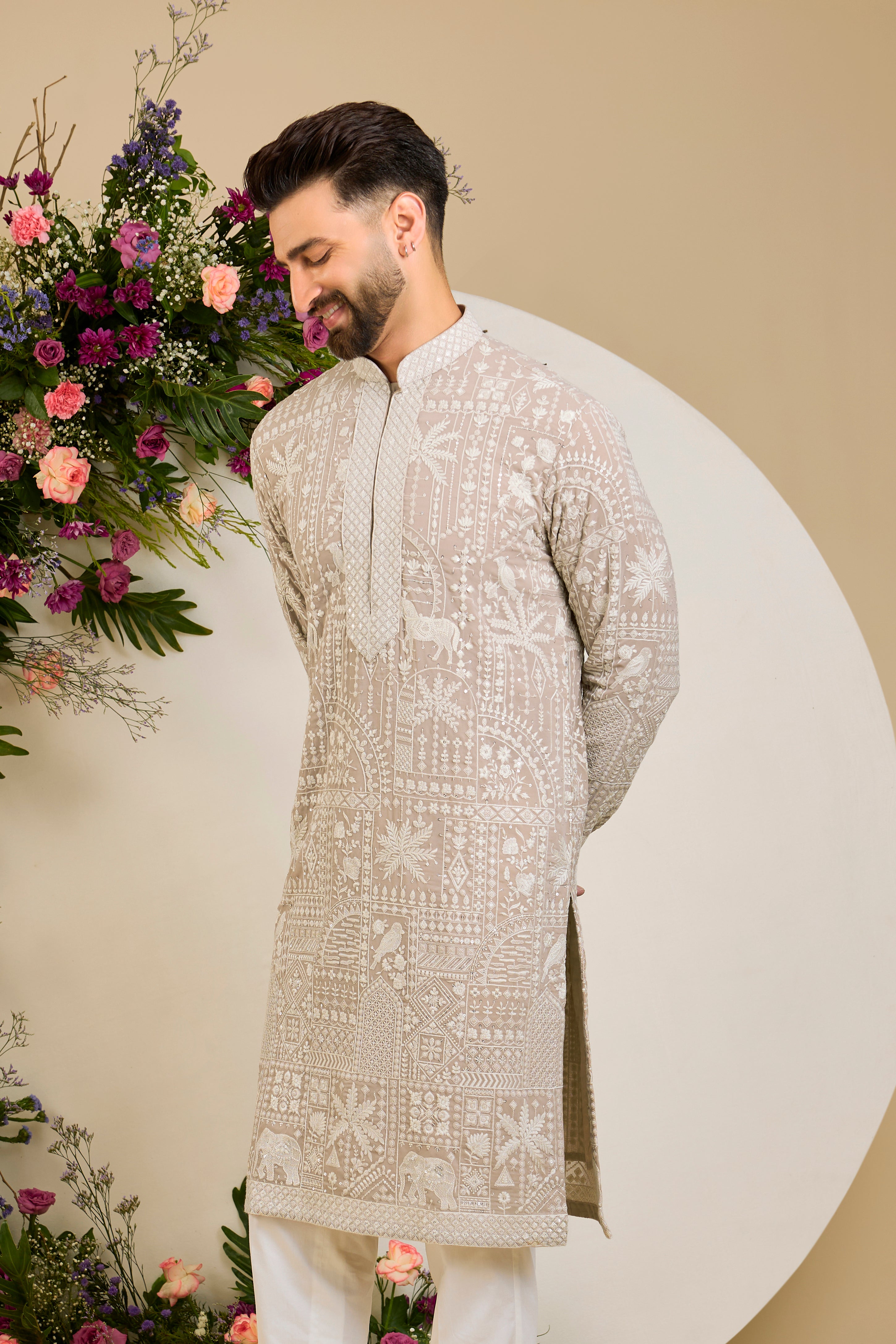 Light beige- mouse kurta with flora and fauna embroidery, an embellished neckline, ivory threadwork, and delicate sequin detailing.