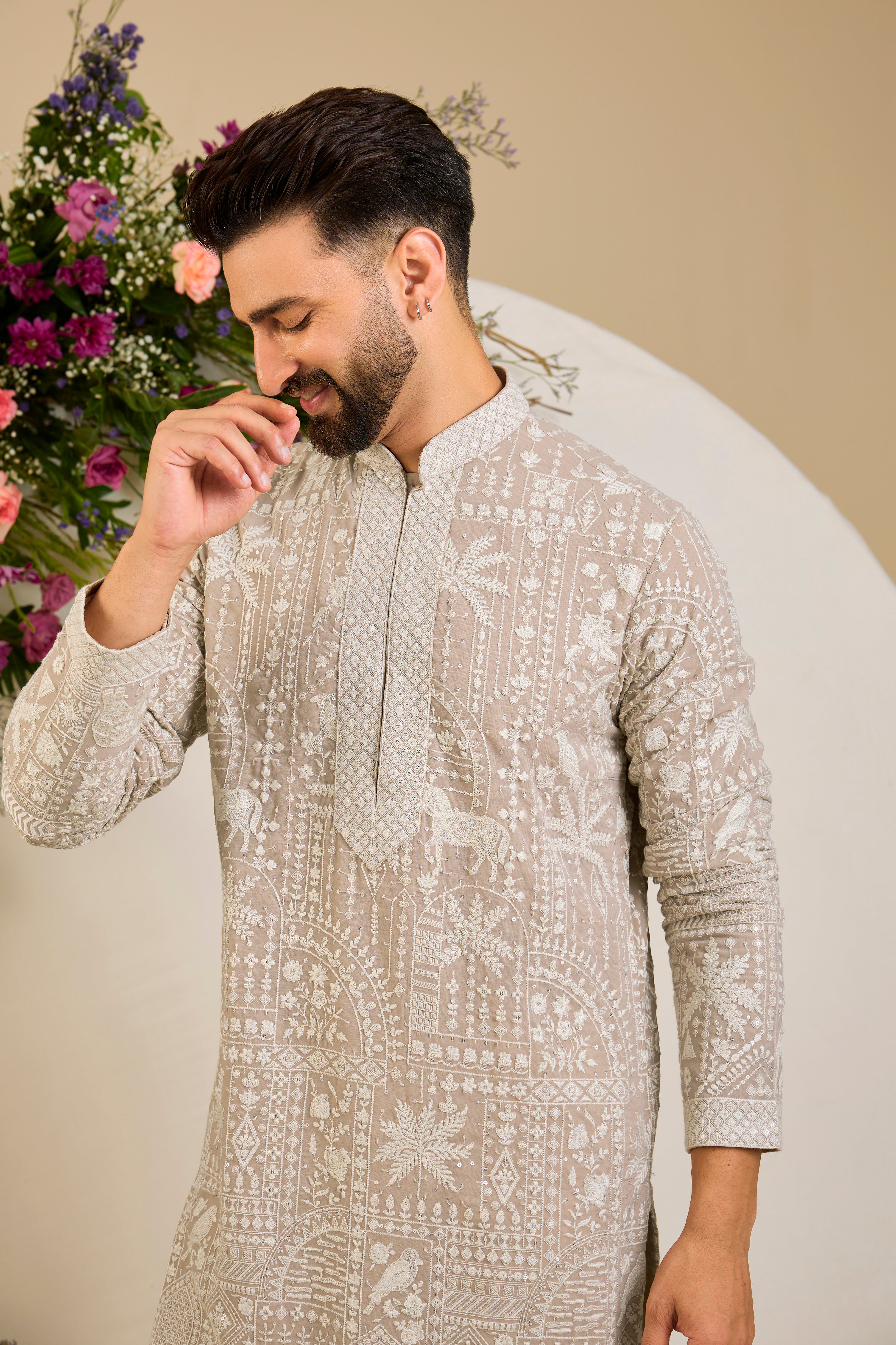 Light beige- mouse kurta with flora and fauna embroidery, an embellished neckline, ivory threadwork, and delicate sequin detailing.