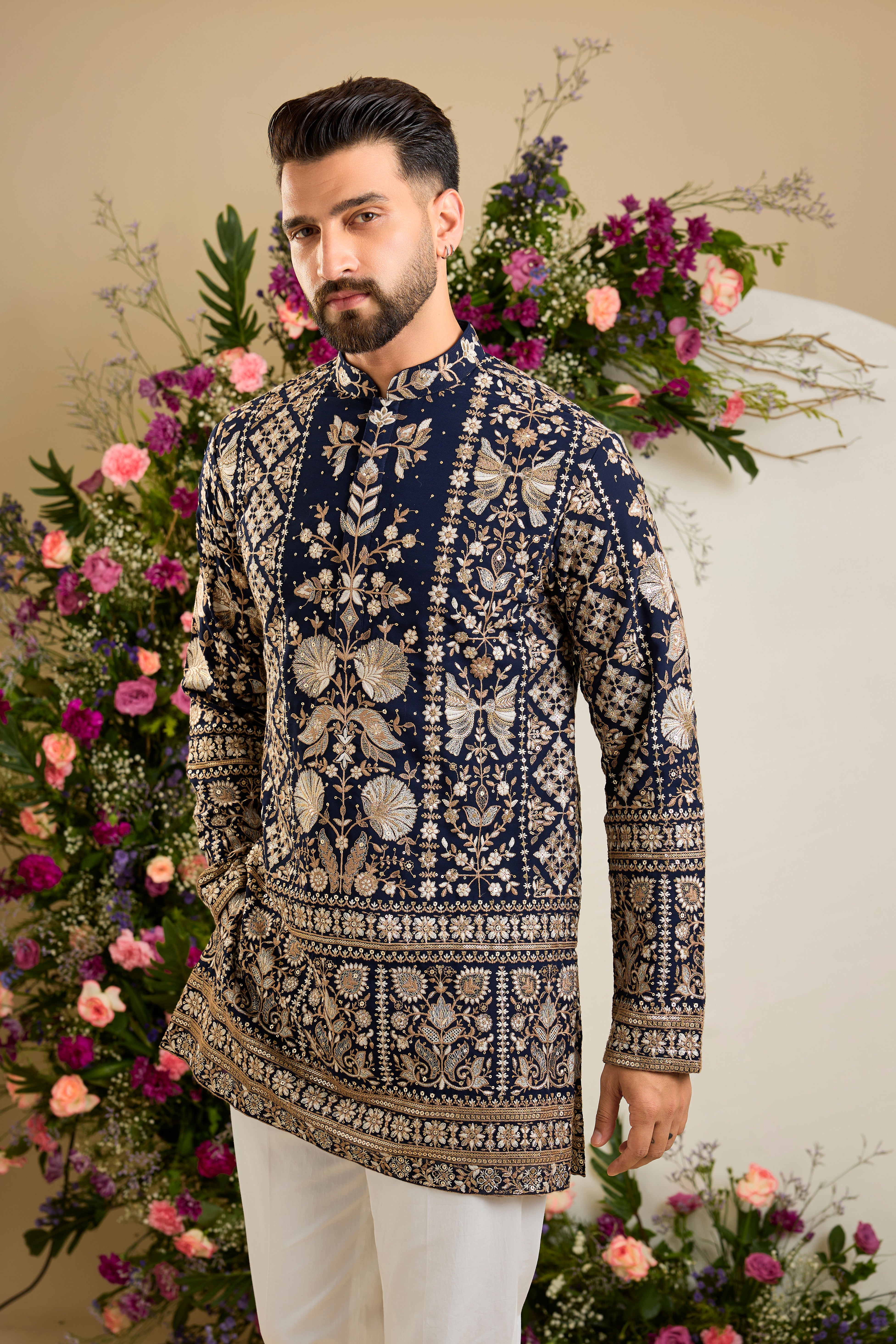 Navy blue floral short kurta with intricate sequin and zari detailing, tailored for timeless elegance and distinguished celebrations.