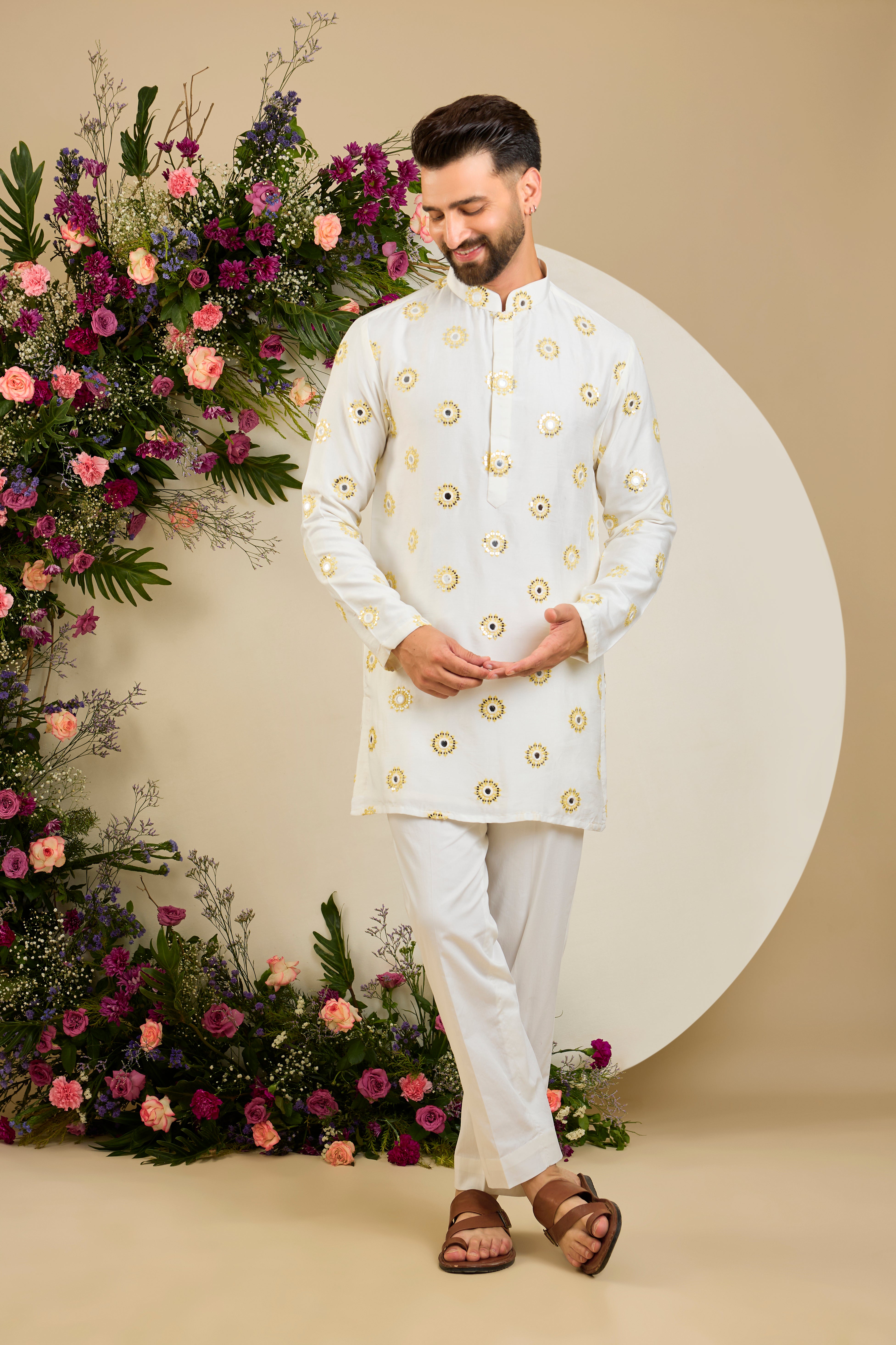 Ivory white mirror work kurta with yellow thread embroidery and delicate sequin detailing for sophisticated occasion wear.
