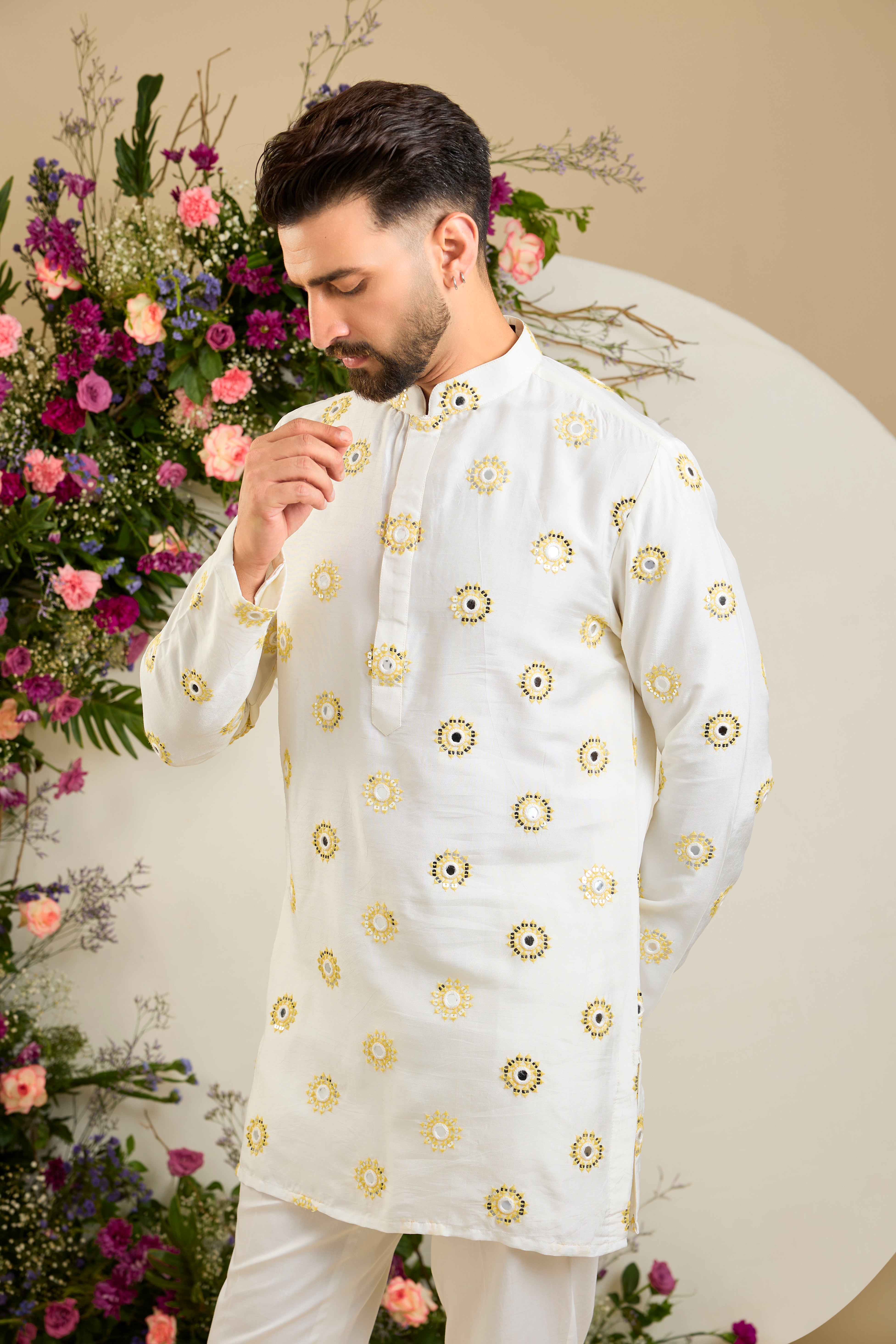 Ivory white mirror work kurta with yellow thread embroidery and delicate sequin detailing for sophisticated occasion wear.