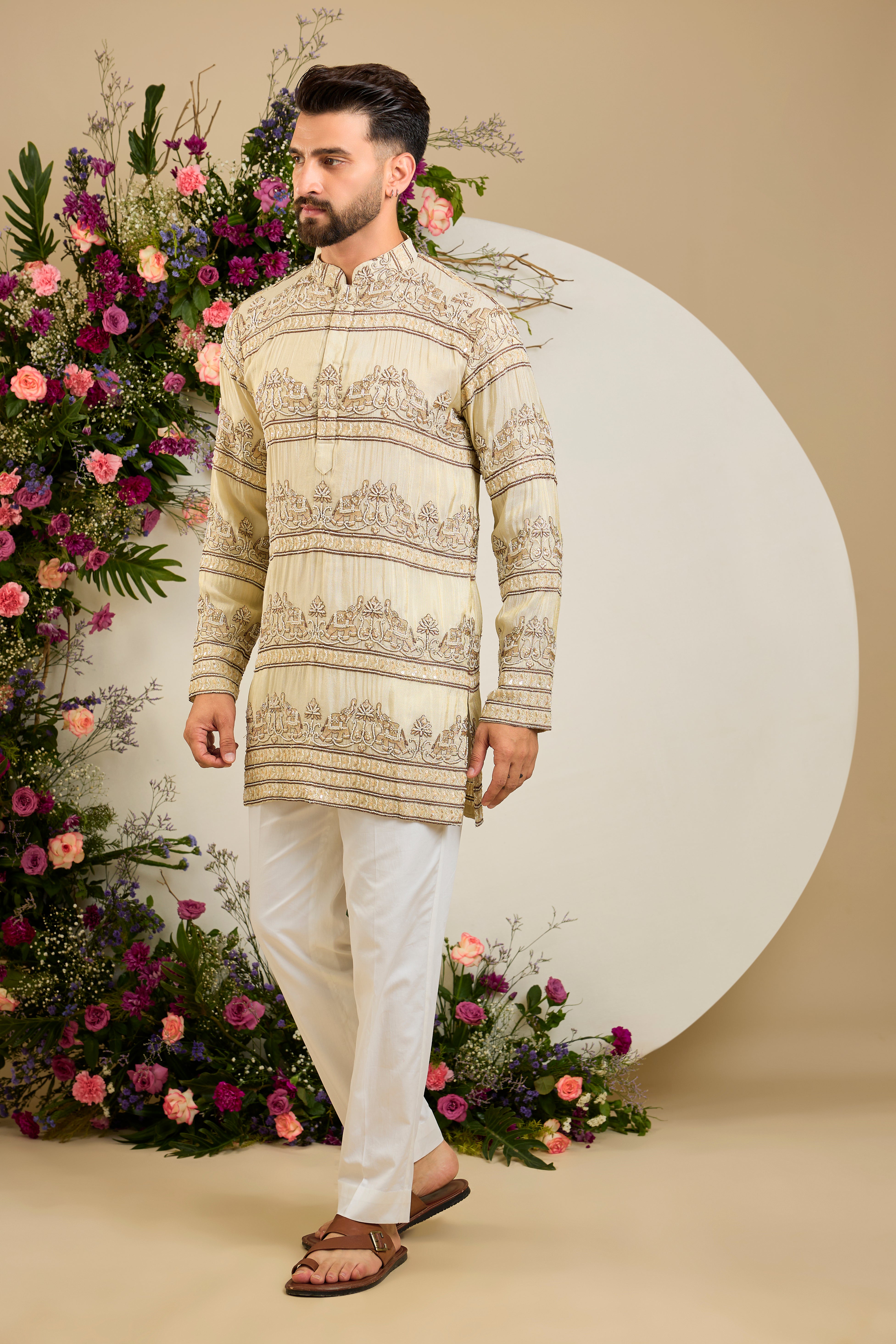 Antique gold tissue kurta with hand-embroidered cut dana work and majestic elephant motifs for grand ceremonial elegance.
