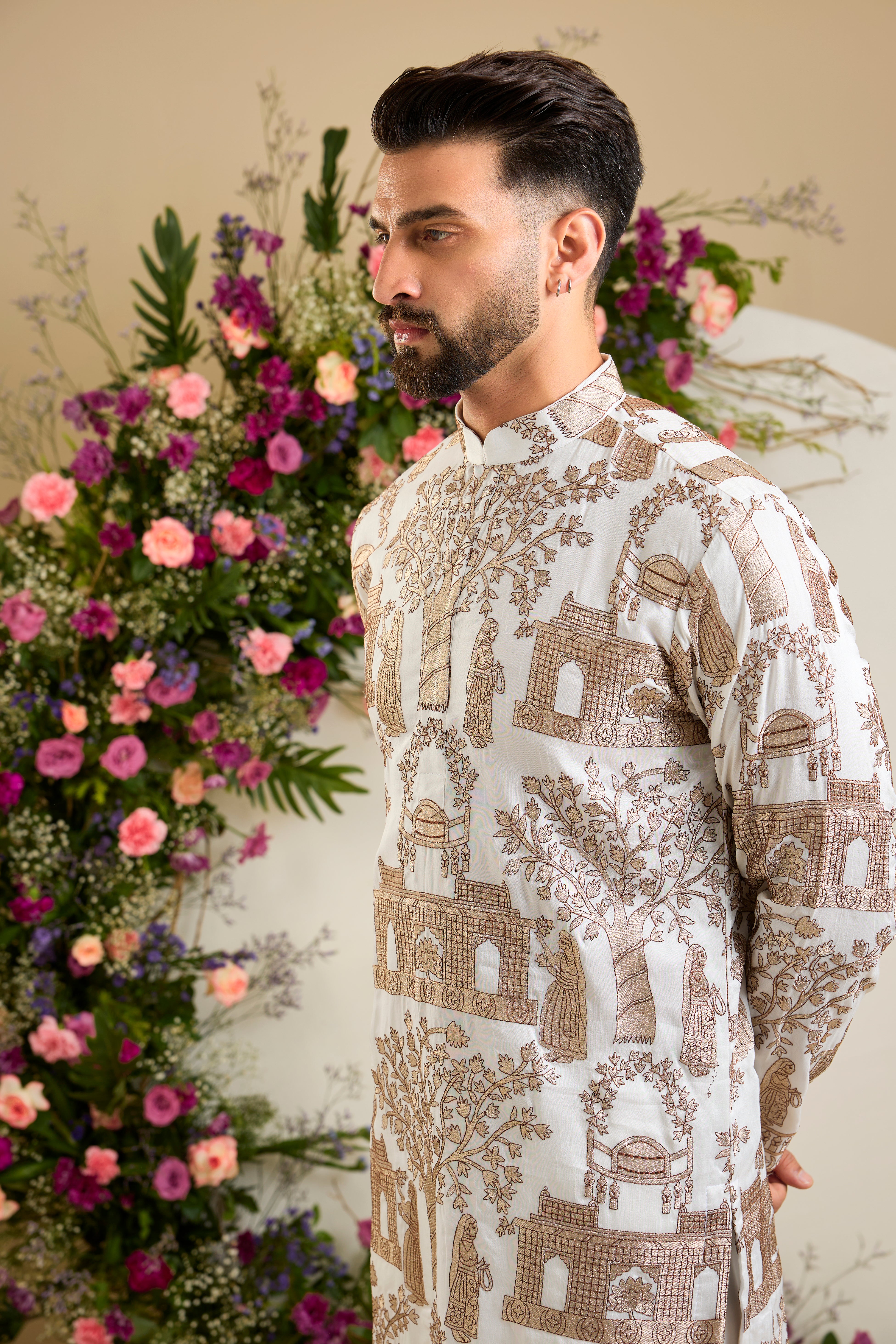 Ivory white silk kurta with intricate Mughal-inspired zari embroidery, celebrating the grandeur and artistry of a royal legacy.