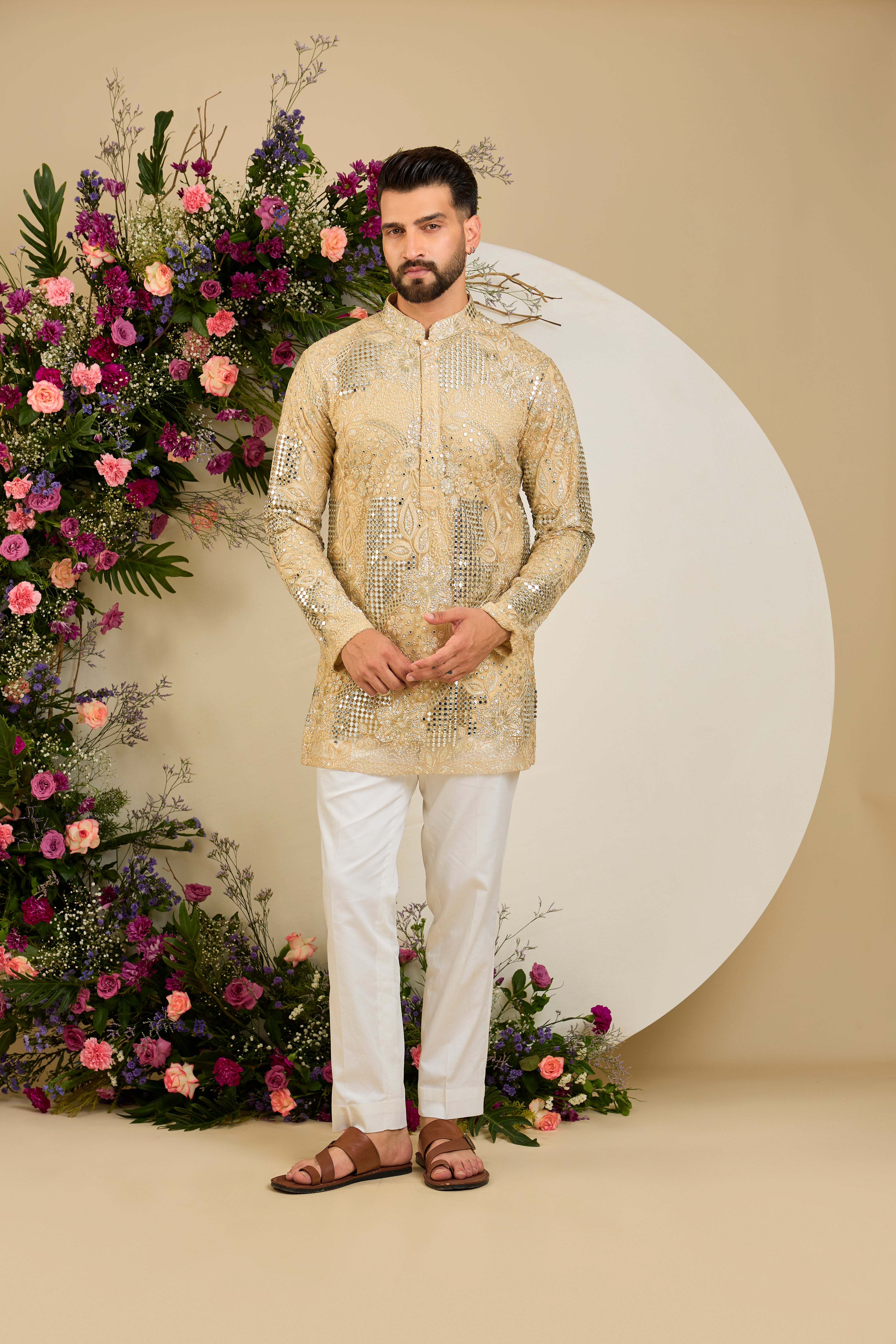 Golden mirror work kurta with intricate floral embroidery and refined zari detailing for timeless occasion elegance.